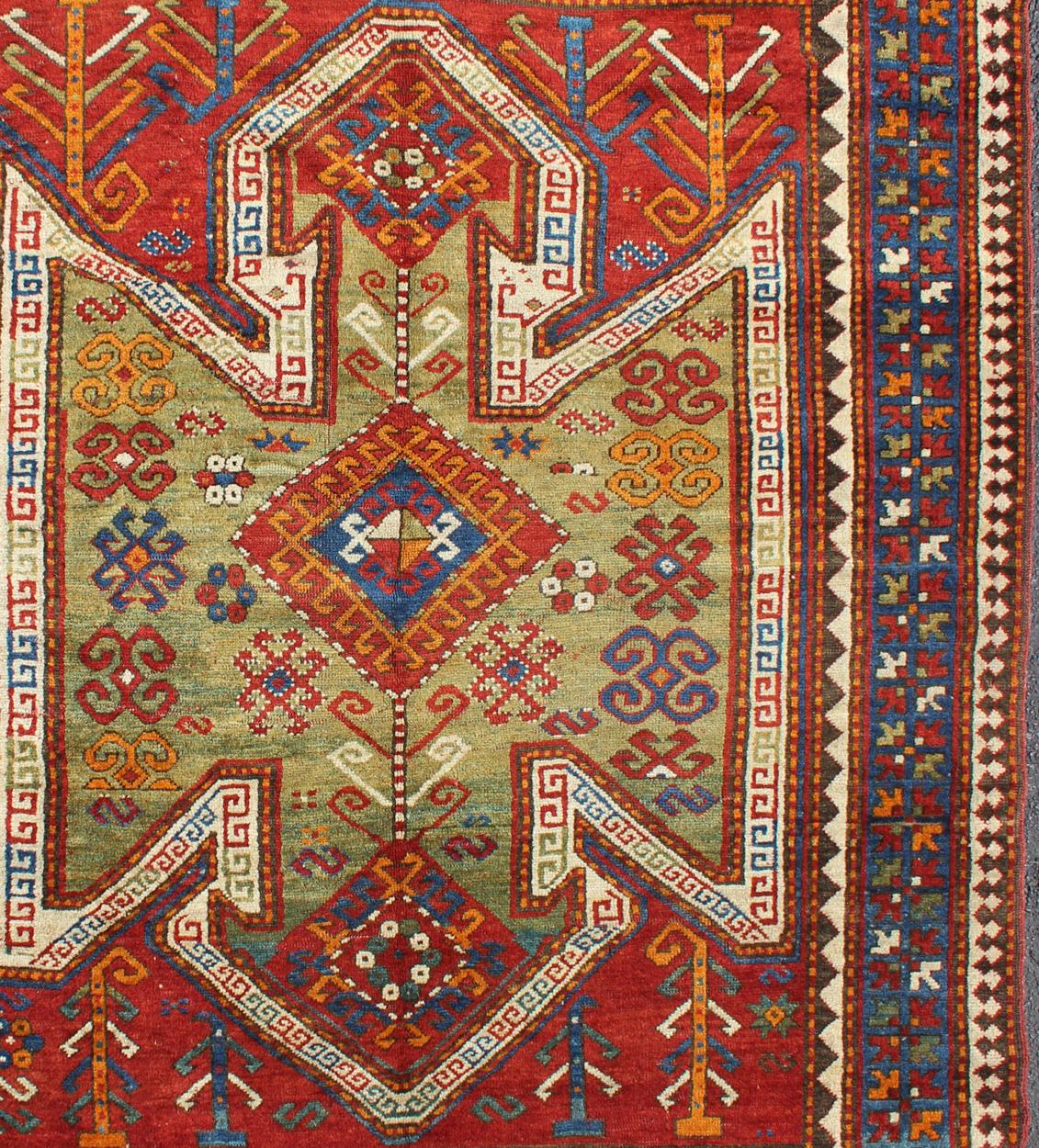 Hand-Knotted Antique Caucasian Sewan Kazak Rug with Large-Scale Tribal Design in Red & Green For Sale