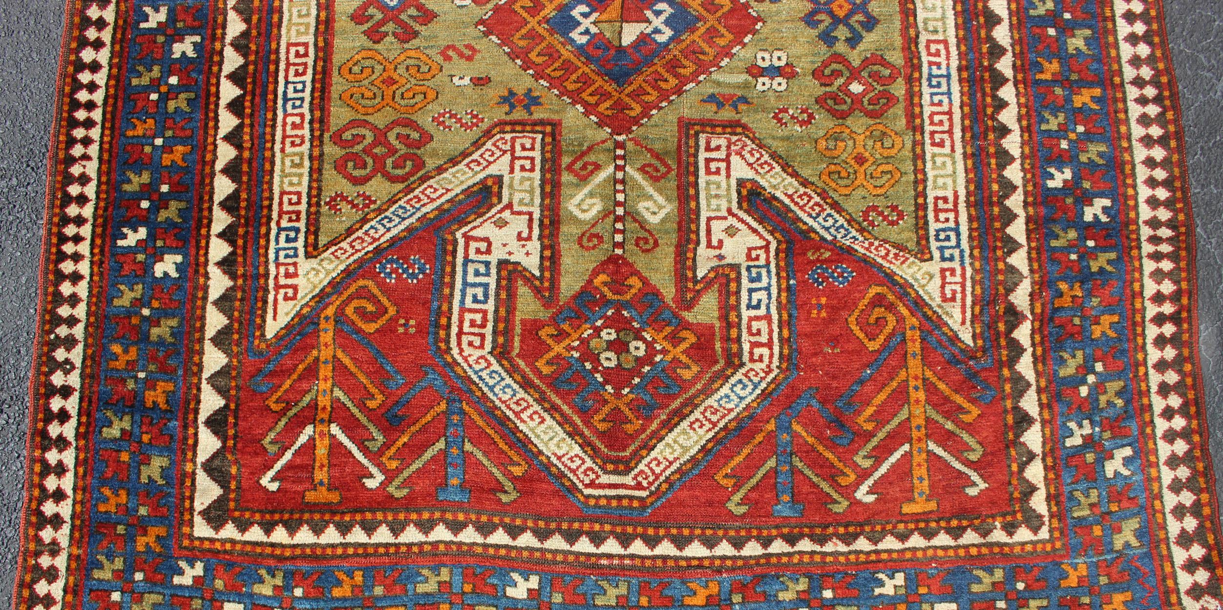 Wool Antique Caucasian Sewan Kazak Rug with Large-Scale Tribal Design in Red & Green For Sale