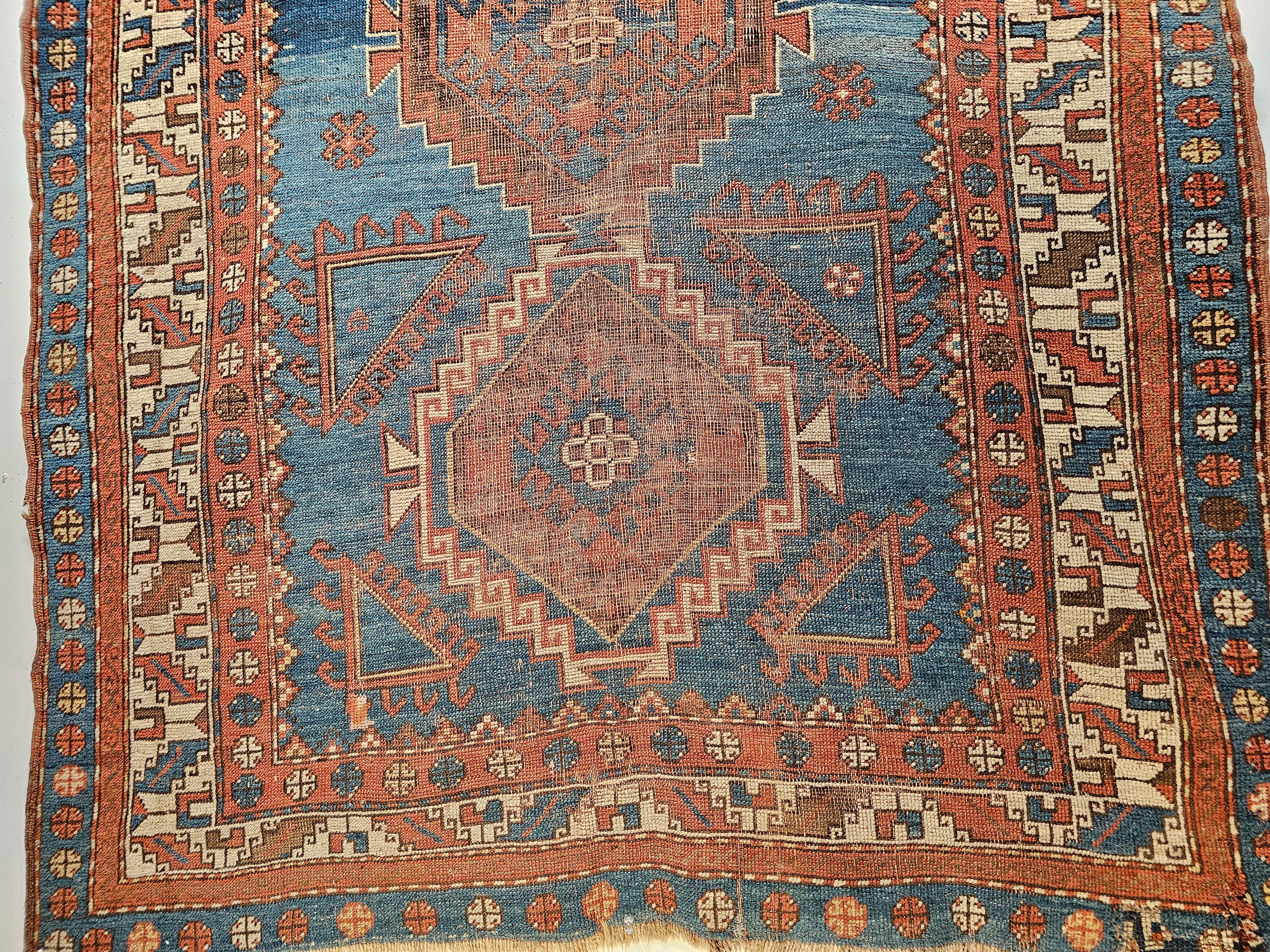 A beautiful Kazak area rug was woven in the 4th quarter of the 1800s. The artistry and craftsmanship are clearly visible in the use of high-quality materials and dyes. The rug has a very unique and desirable abrash French blue field color which is