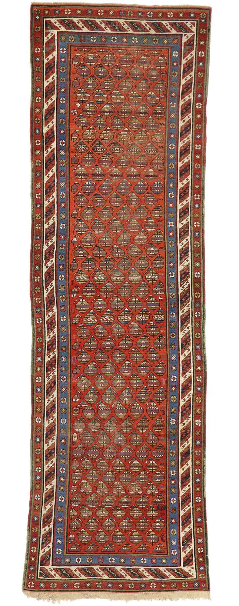 73231 Antique Caucasian Shirvan Boteh Runner with Tribal Style, Hallway Runner 03'03 x 11'00. This antique Caucasian Shirvan hallway runner displays an all-over repetitive pattern of opulent boteh motifs. The widely used boteh motif is thought to
