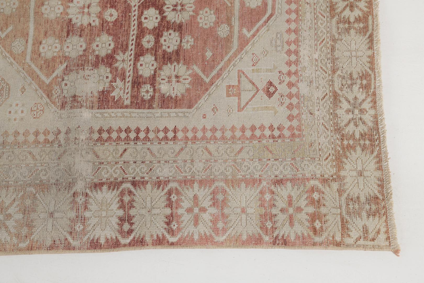 A compelling antique Caucasian Shirvan rug that features stunning geometric design reminiscent of windows gazing through the beguiling botanicals in the abrashed brick red field. Enclosed by the dainty floral border with the stunning evident age