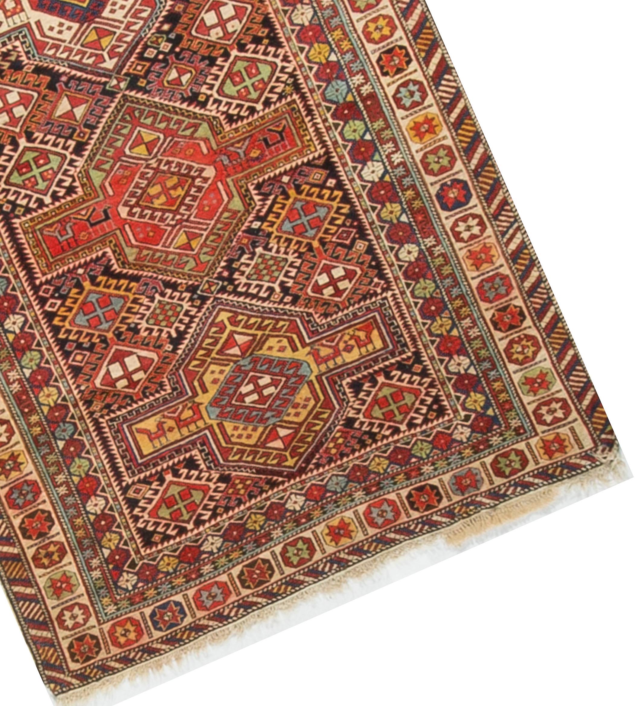A lovely small Caucasian Shirvan handwoven rug, circa 1880. The central field filled with a myriad of designs, hidden away is also depictions of animals that as a special interest to this piece. The main border is filled with delightful floral