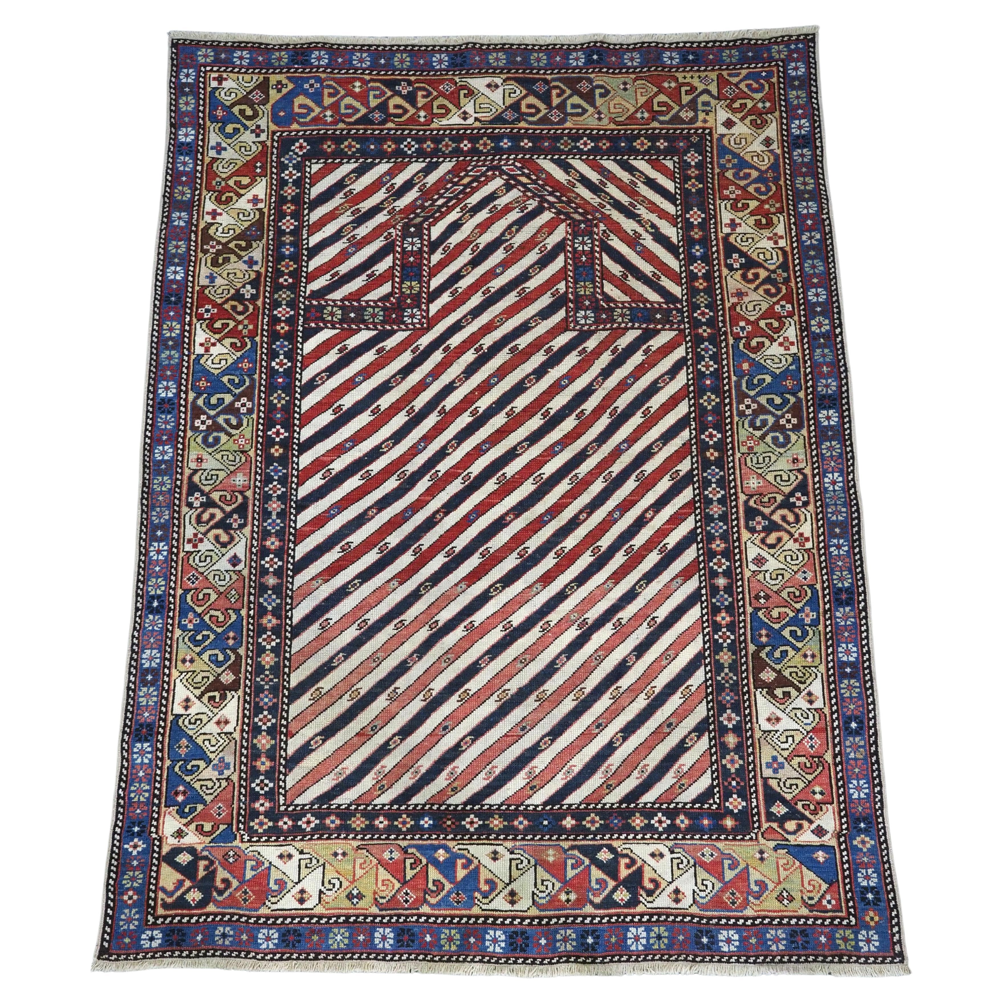 Antique Caucasian Shirvan/Dagestan prayer rug with scarce diagonal stipe design. For Sale