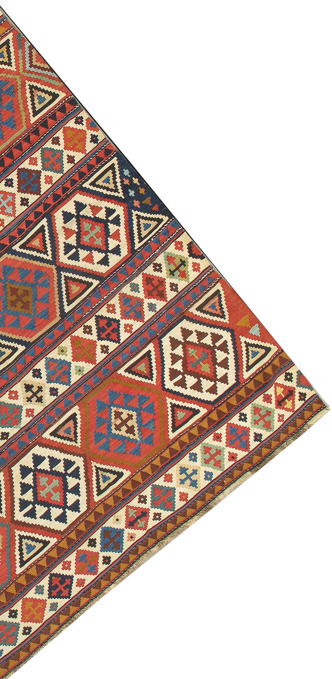 Antique Caucasian Shirvan Kilim 5'1 x 9'6. This is a Kilim weave (slit tapestry) flat-woven small carpet from the Shirvan area in a pattern absolutely characteristic of the group. Wide and narrower horizontal bands alternate with stepped hexagons