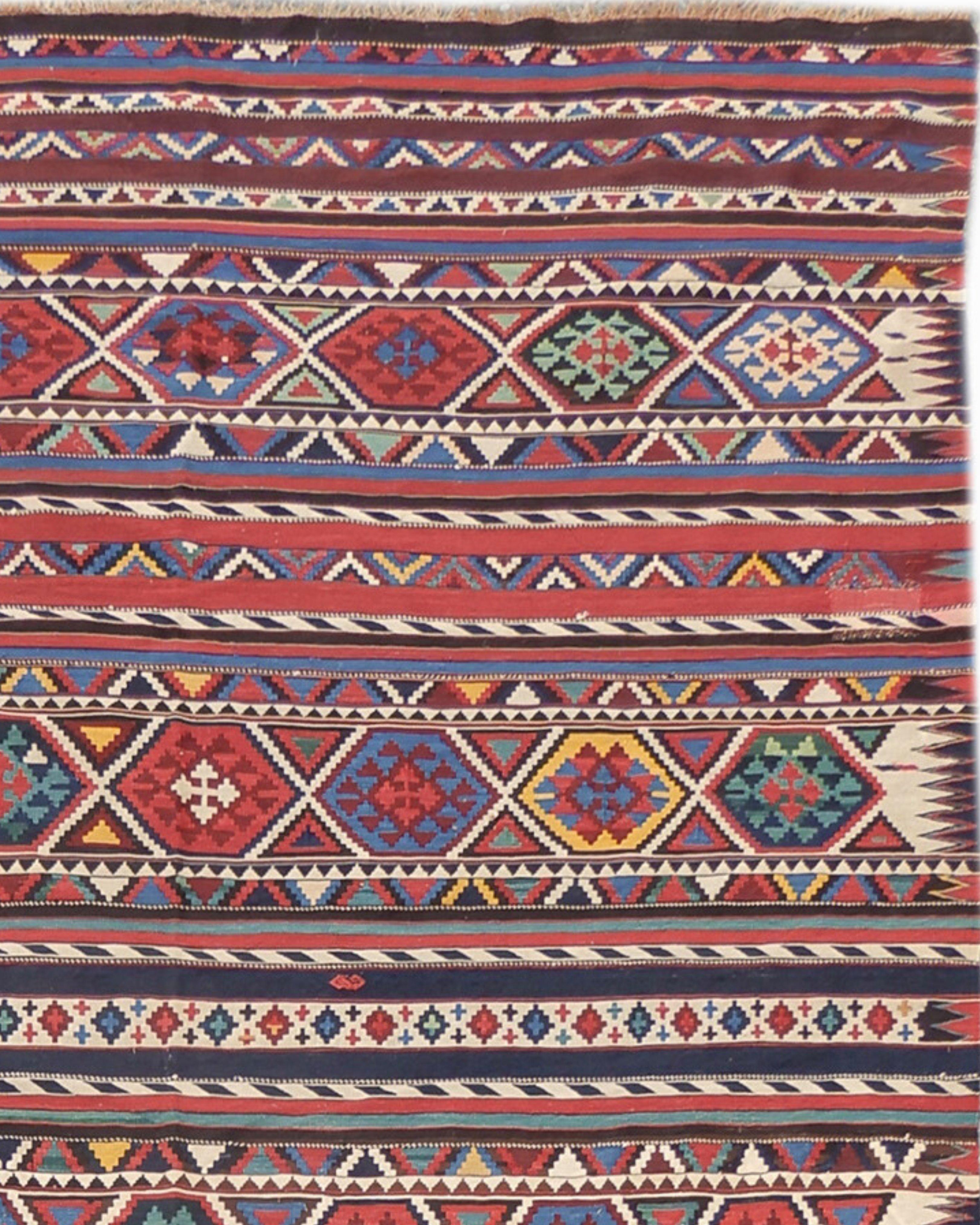 Antique Caucasian Shirvan Kilim Rug, Late 19th Century

This Caucasian Shirvan kilim combines a fine weave with diverse colors incorporating no fewer than three reds and blues each, as well as gold and greens. Rows of graphic latch-hook diamonds are