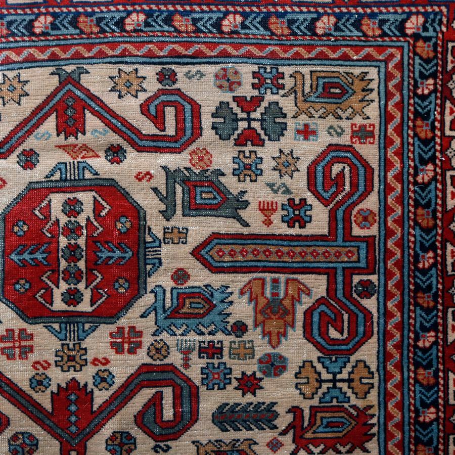 A Caucasian Shirvan Kuba Perepedil rug offers repeating angular geometric center medallions with stylized rams horns, blossoms and flowers, wide Kufic border, finely woven and excellent color, circa 1920. 

***DELIVERY NOTICE – Due to COVID-19 we