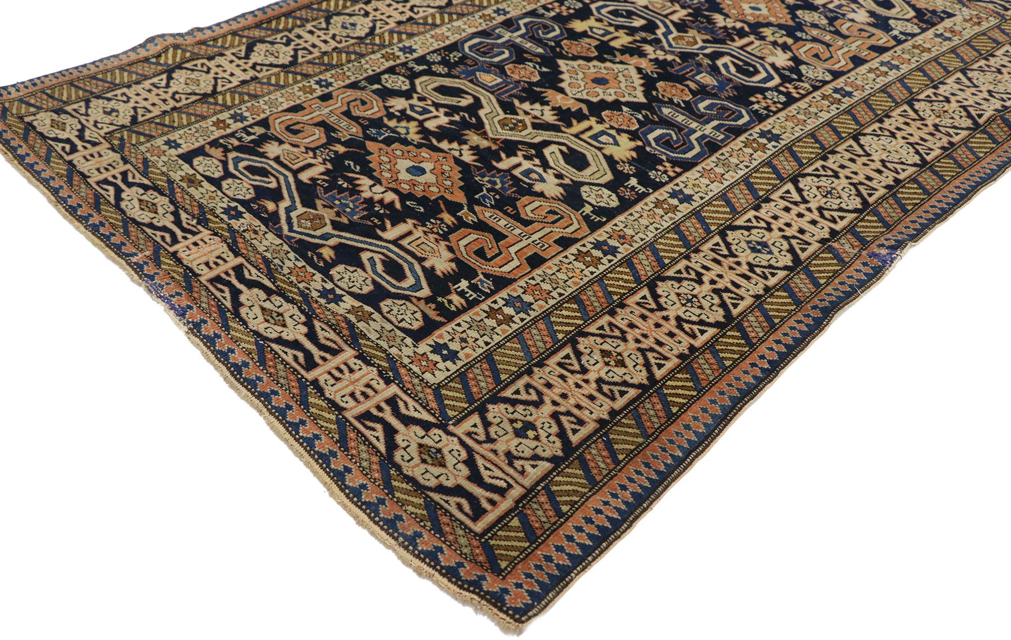 77658, antique Caucasian Shirvan Kuba rug with Tribal style. Give the look of woven wonders and nomadic charm with this hand-knotted wool antique Caucasian Shirvan Kuba rug. The navy blue field features a variety of ambiguous tribal motifs: Ram's