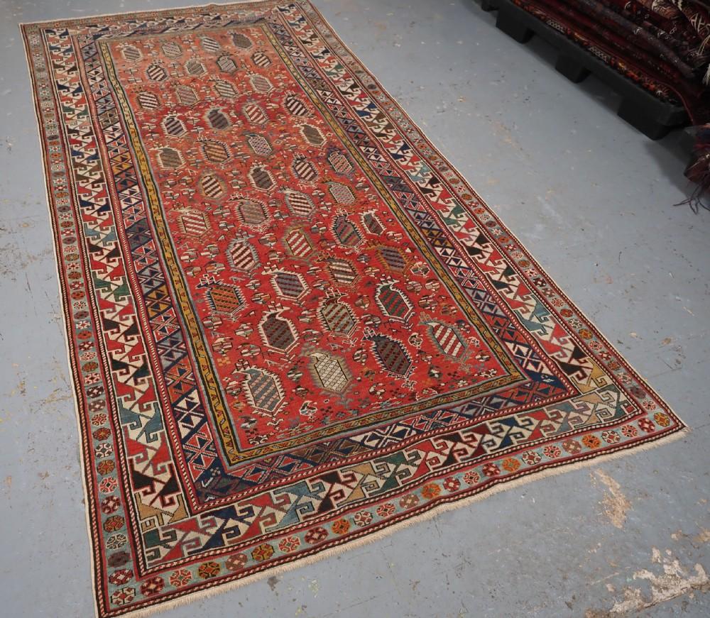 Antique Caucasian Shirvan Marasali rug with repeat 'flaming boteh' design
Circa 1880

A beautiful fine rug with a repeat design of flaming boteh in rows, each boteh is filled with the classic Marasali stripe design Each row of boteh is separated