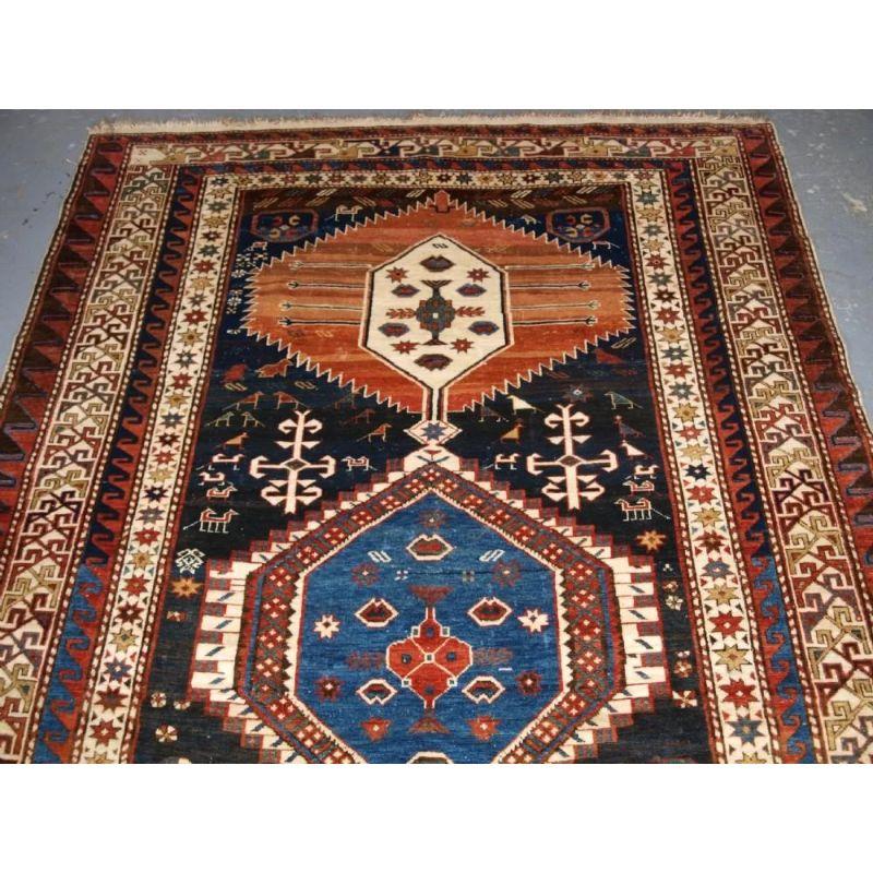 Antique Caucasian Shirvan rug of the classic linked medallion design, large size. Circa 1890. A good example of the classic Shirvan triple linked medallion design, the three serrated edge hexagonal medallions have smaller hexagons to the centre. The