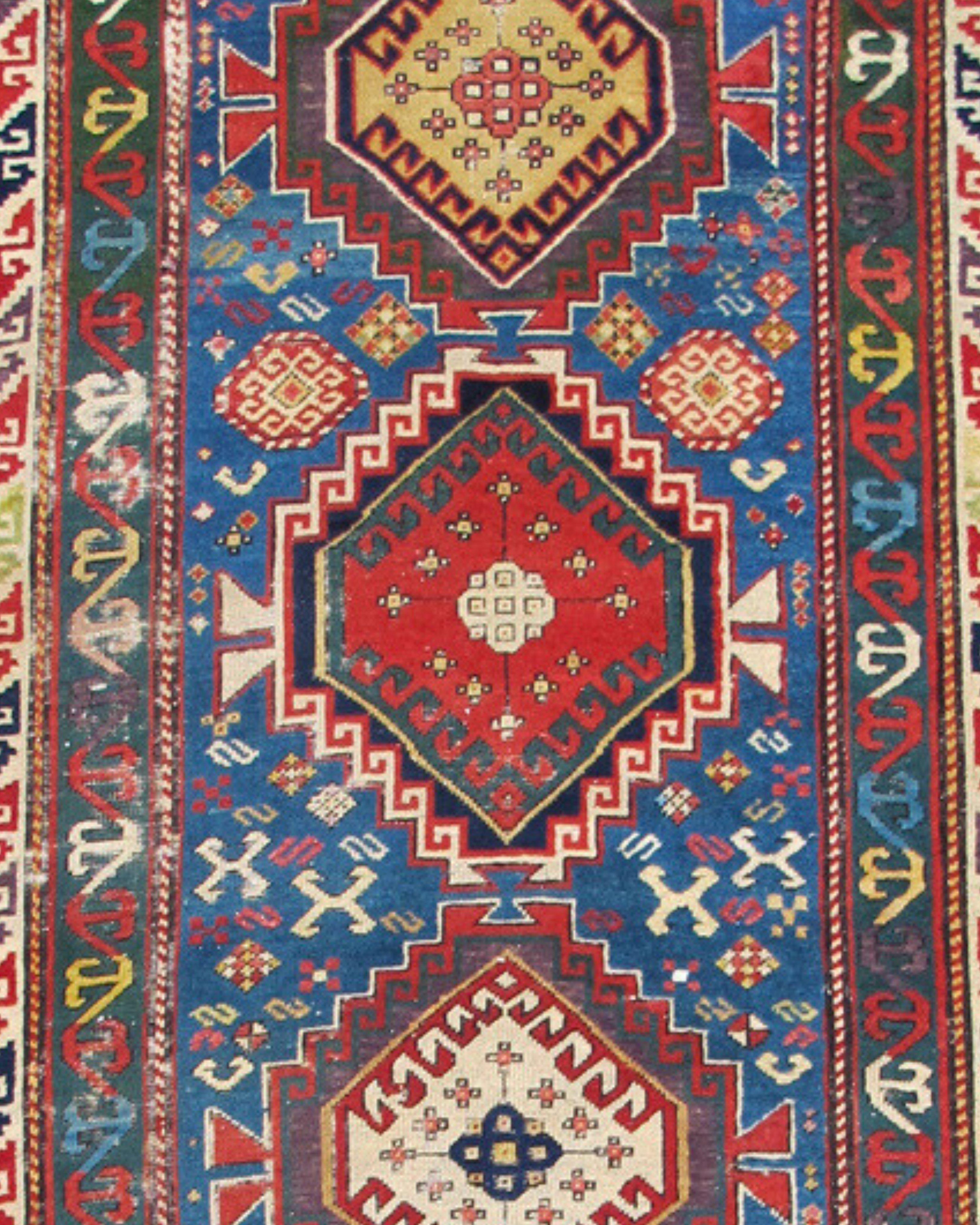 Antique Caucasian Shirvan Rug, 19th Century

Vivid color is used expertly in this fine Shirvan long rug from the South Caucasus. Several blues harmonize with each other while vibrant reds and greens are used for perfect contrast and subtle