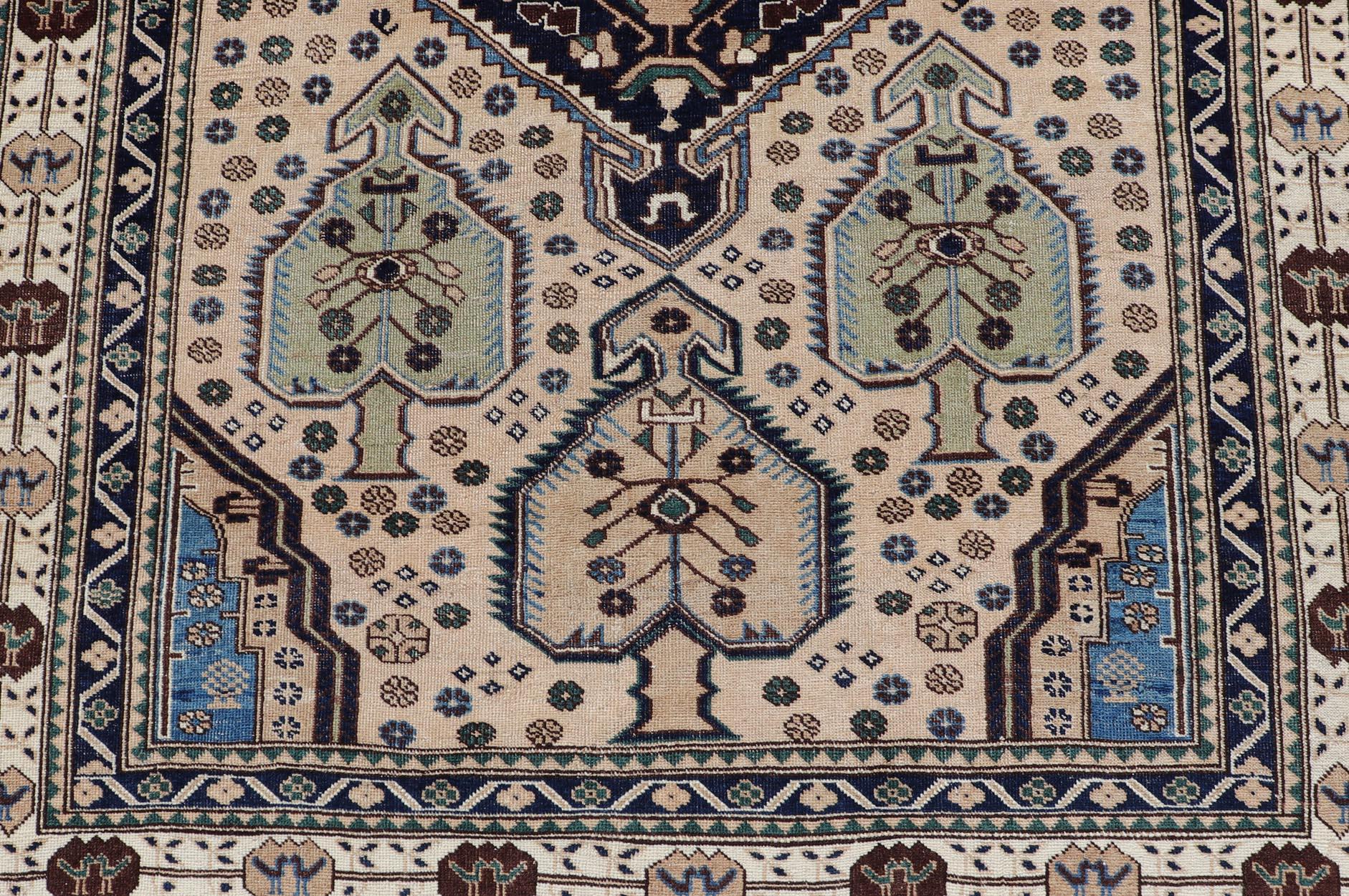 Antique Caucasian Shirvan Rug in Blue, Green, and Cream with Tribal Design. Keivan Woven Arts / rug EMB-22186-15067, country of origin / type: Caucasus / Kazak, circa late-19th Century.
Measures: 4'8 x 6'8 
The field of this Caucasian piece features