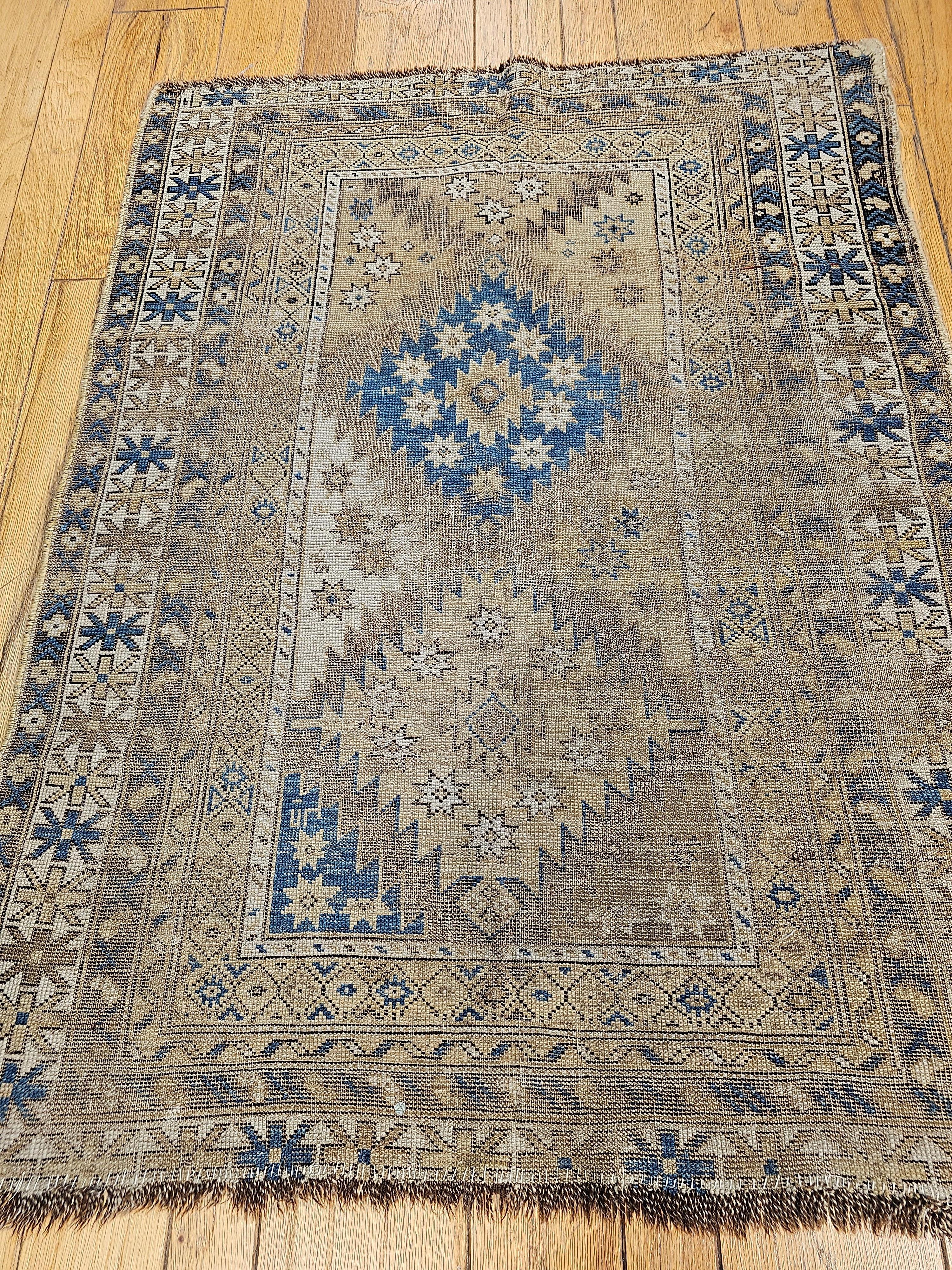 Antique Caucasian Shirvan Rug in Pale French Blue, Ivory and Chocolate Colors.  This beautiful Shirvan village area rug was woven in the Azerbaijan region of the southern Caucasus.  The Shirvan area rug has a triple medallion design in earth tones