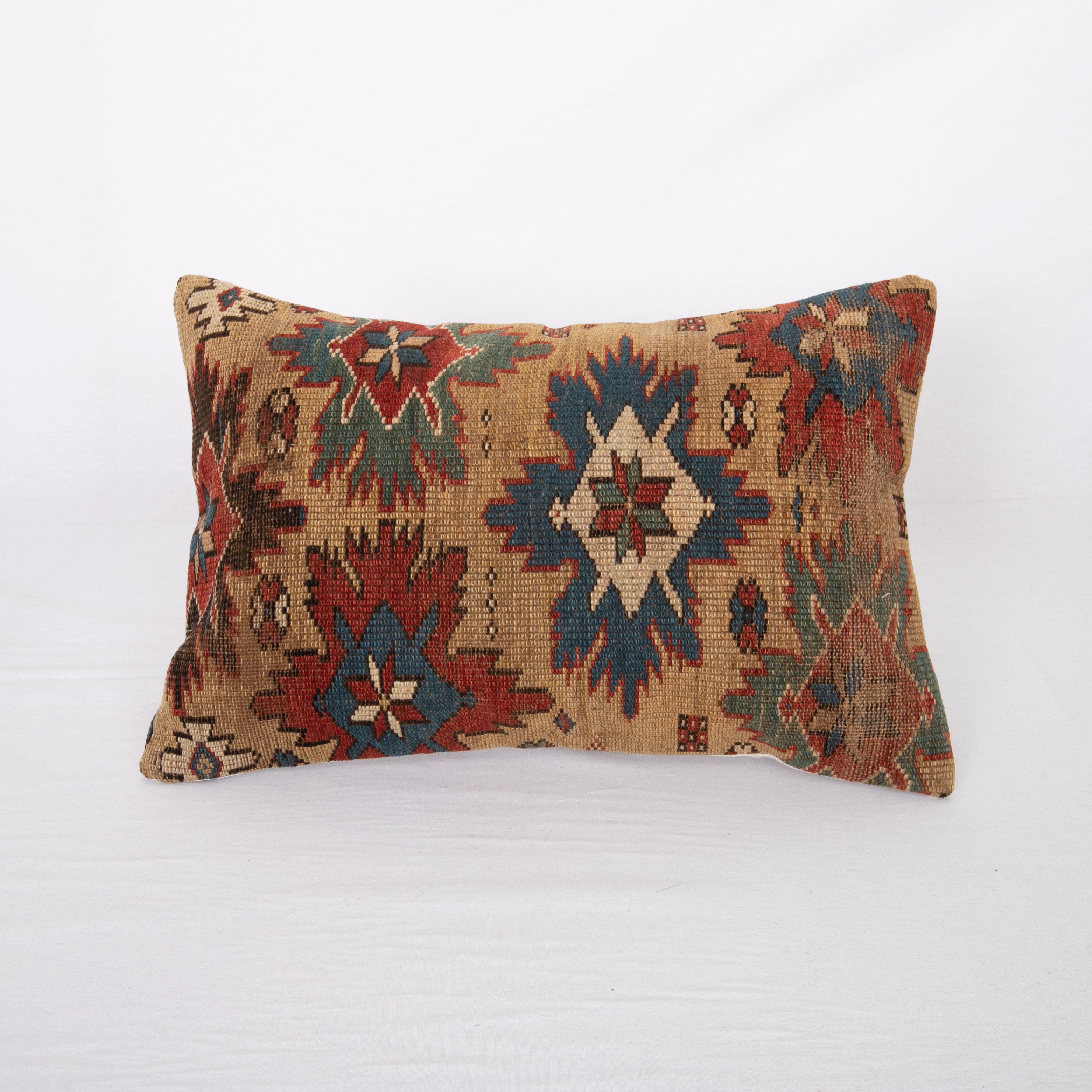 This pillowcase is made from an antique Caucasian, shrivan rug.
It does not come with an insert.
Linen in the back.
Zipper closure.
  
    