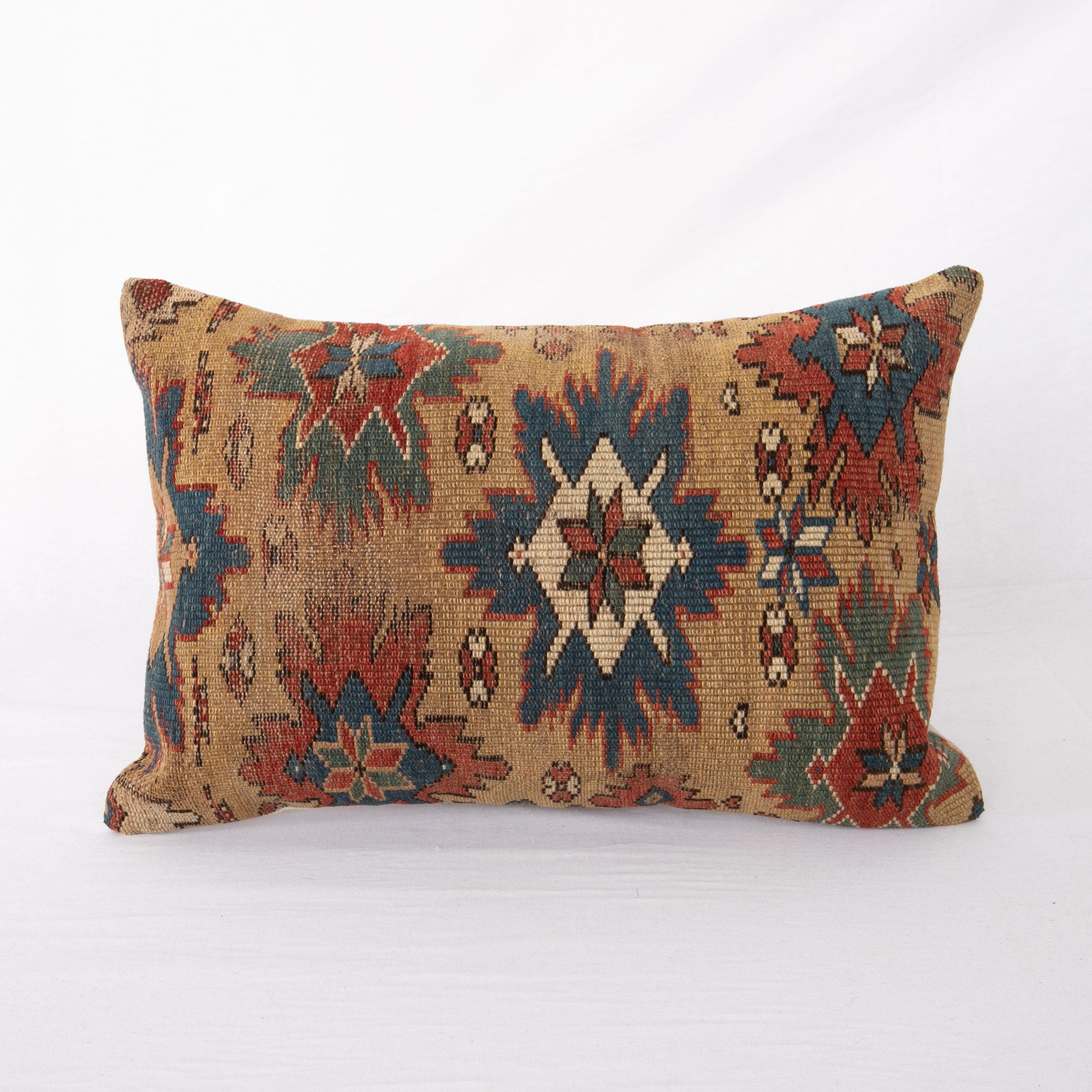 This pillowcase is made from an antique Caucasian, shrivan rug.
It does not come with an insert.
Linen in the back.
Zipper closure.
  