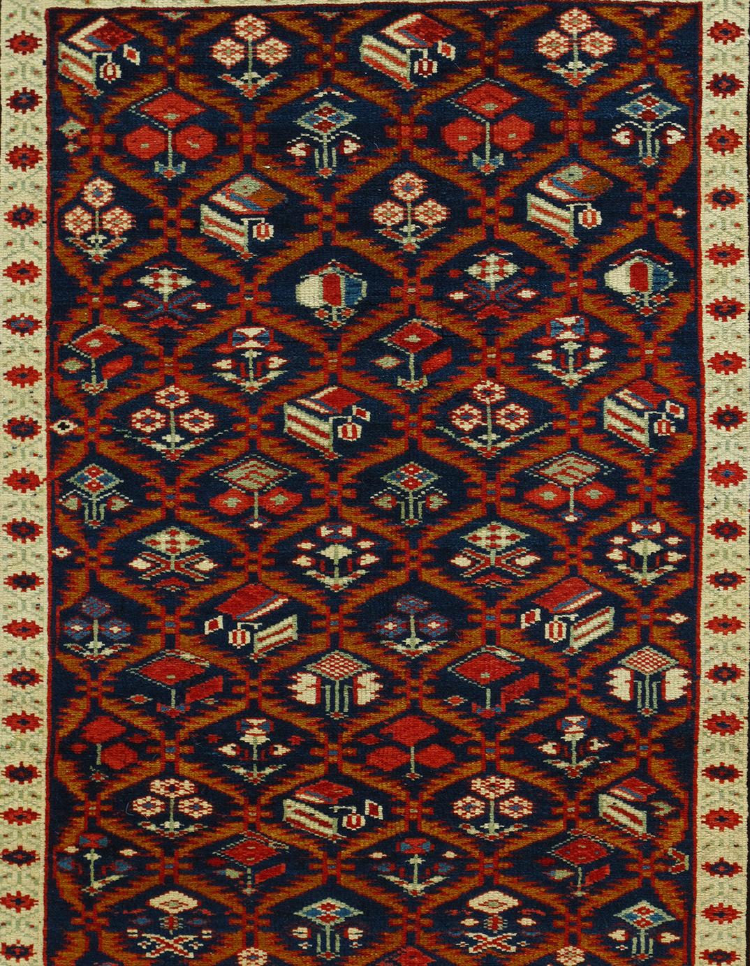 This antique Caucasian Shirvan tribal rug is from Azerbaijan, a country located in the south Caucasus region. It is constructed of 100% handspun wool and natural dyes. This rug features a bold, articulated geometric pattern, which is a very