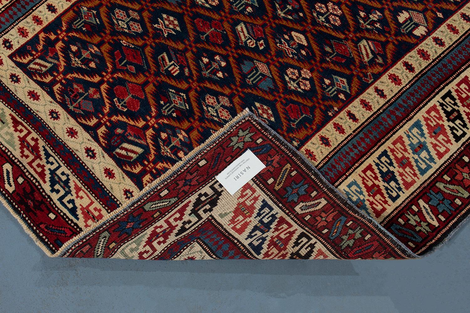 Wool Antique Caucasian Shirvan Rug with a Navy Background For Sale