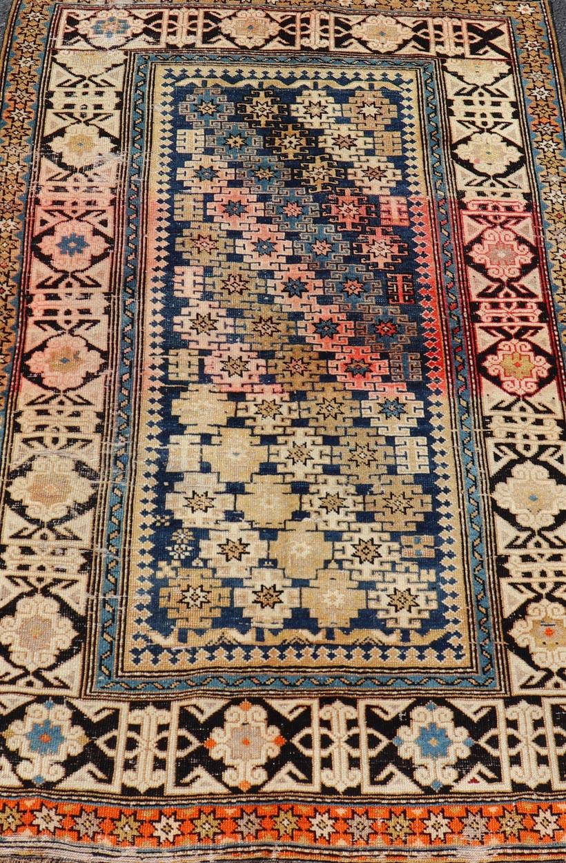 Hand-Knotted Antique Caucasian Shirvan Rug with All-Over Blossoming Tribal Motifs For Sale