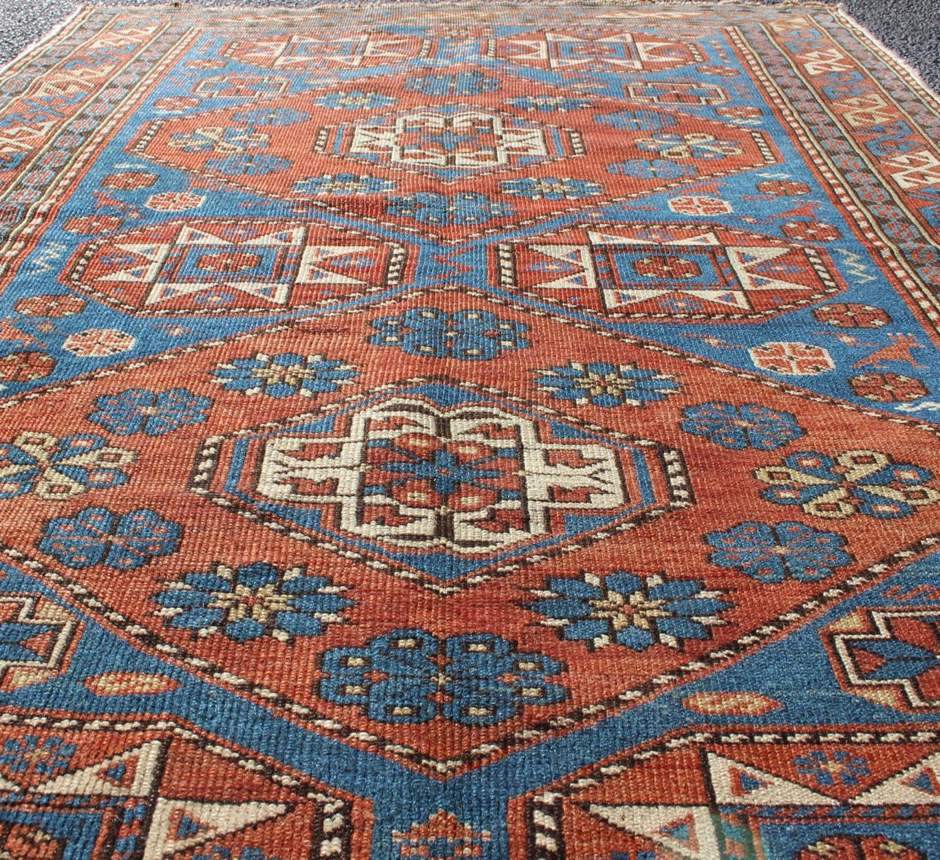 Kazak  Antique Caucasian Shirvan Rug with Geometric Design in Brunt Orange and Blue  For Sale