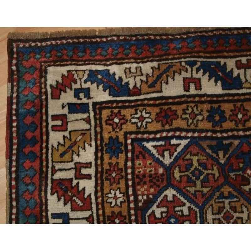 A superb example of a Shirvan runner with multi coloured lattice design, framed by a classic Caucasian 'leaf and wine glass' border on an ivory ground. The rug is of a fine weave with very good wool.

The rug is in excellent condition with slight