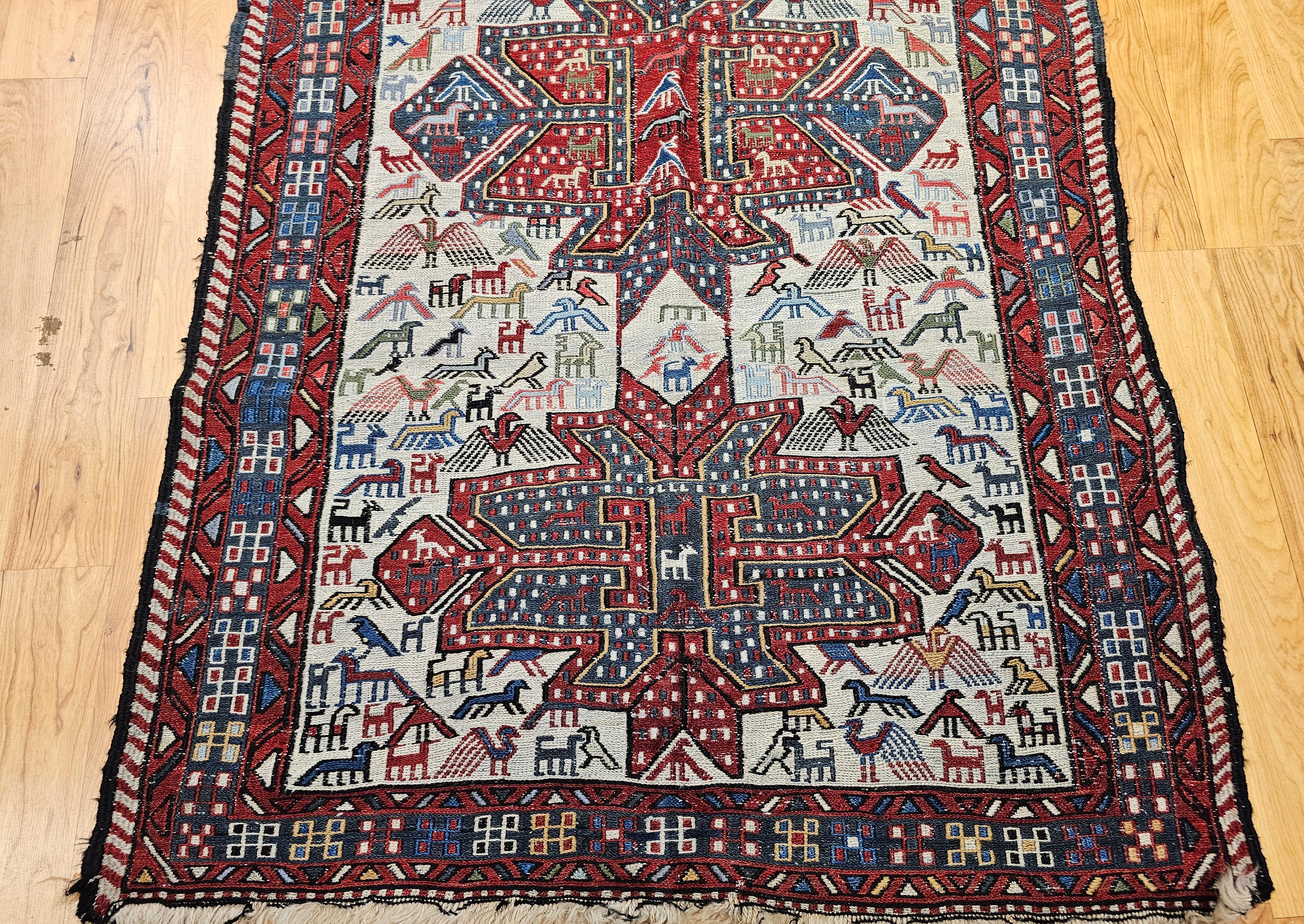 20th Century Antique Caucasian Soumak Area Rug with Bird Motifs in Ivory, Red & Blue For Sale