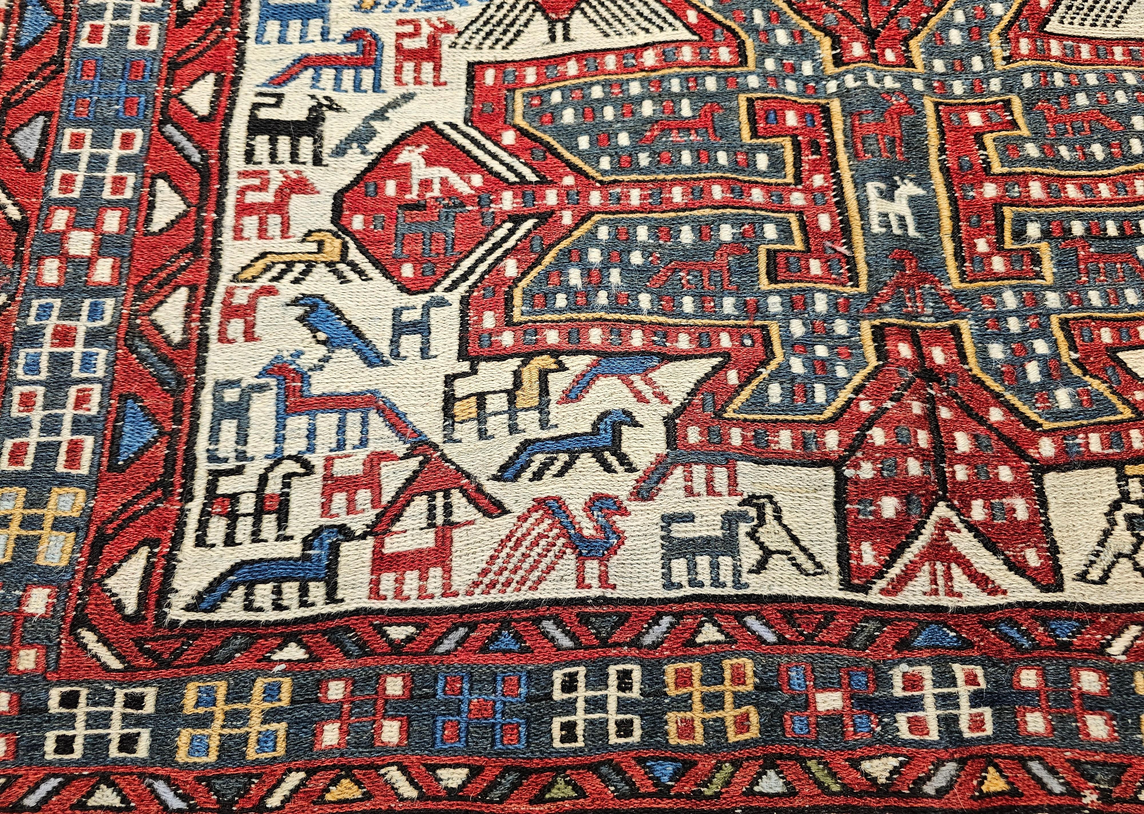 Wool Antique Caucasian Soumak Area Rug with Bird Motifs in Ivory, Red & Blue For Sale