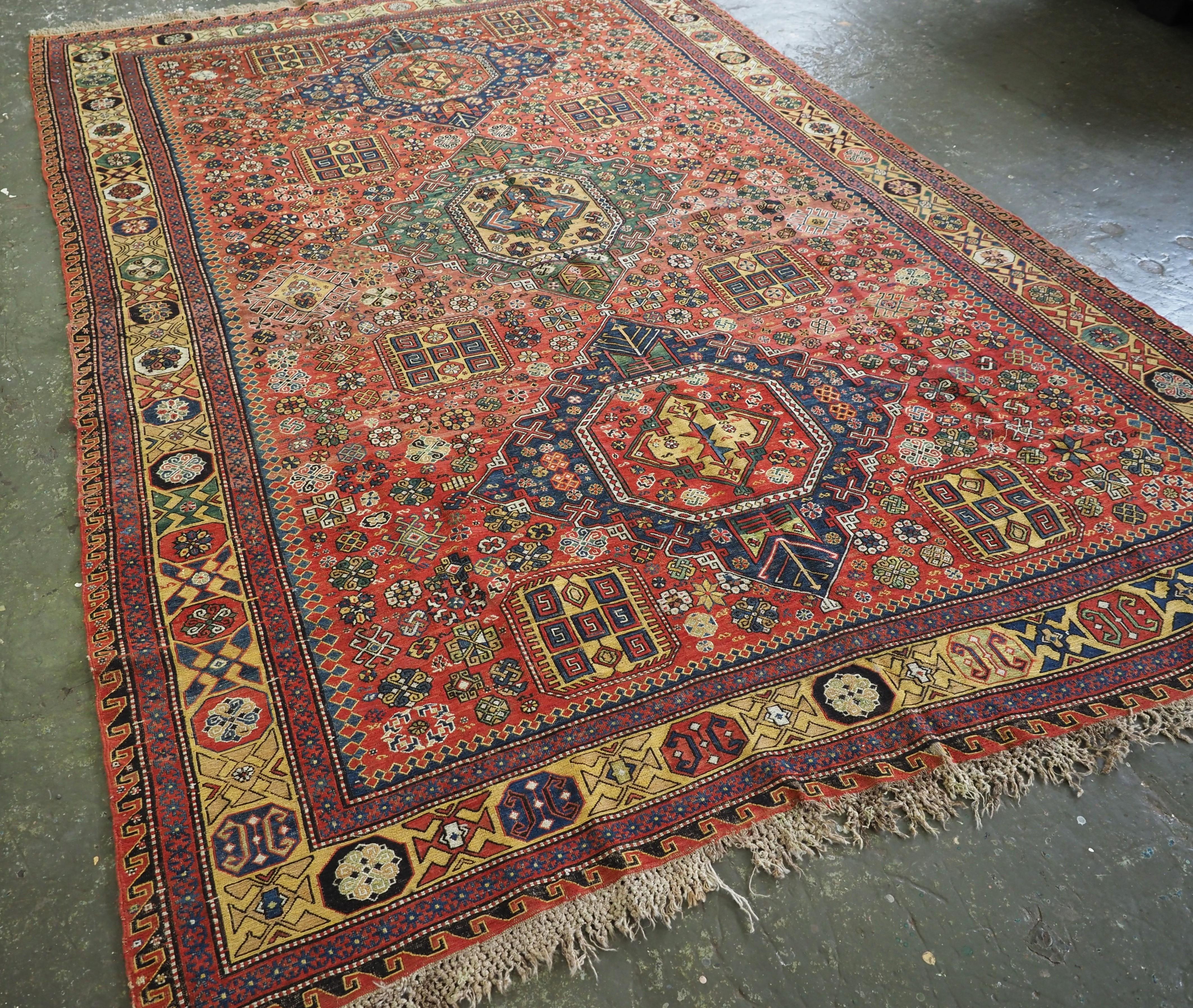 
Size: 312 x 220cm (10ft 3in x 7ft 3in).

Antique Caucasian soumak carpet of three medallion design with scarce yellow border.

Circa 1870 or earlier.

This soumak is of the classic three medallion format, with two blue medallions and a soft green