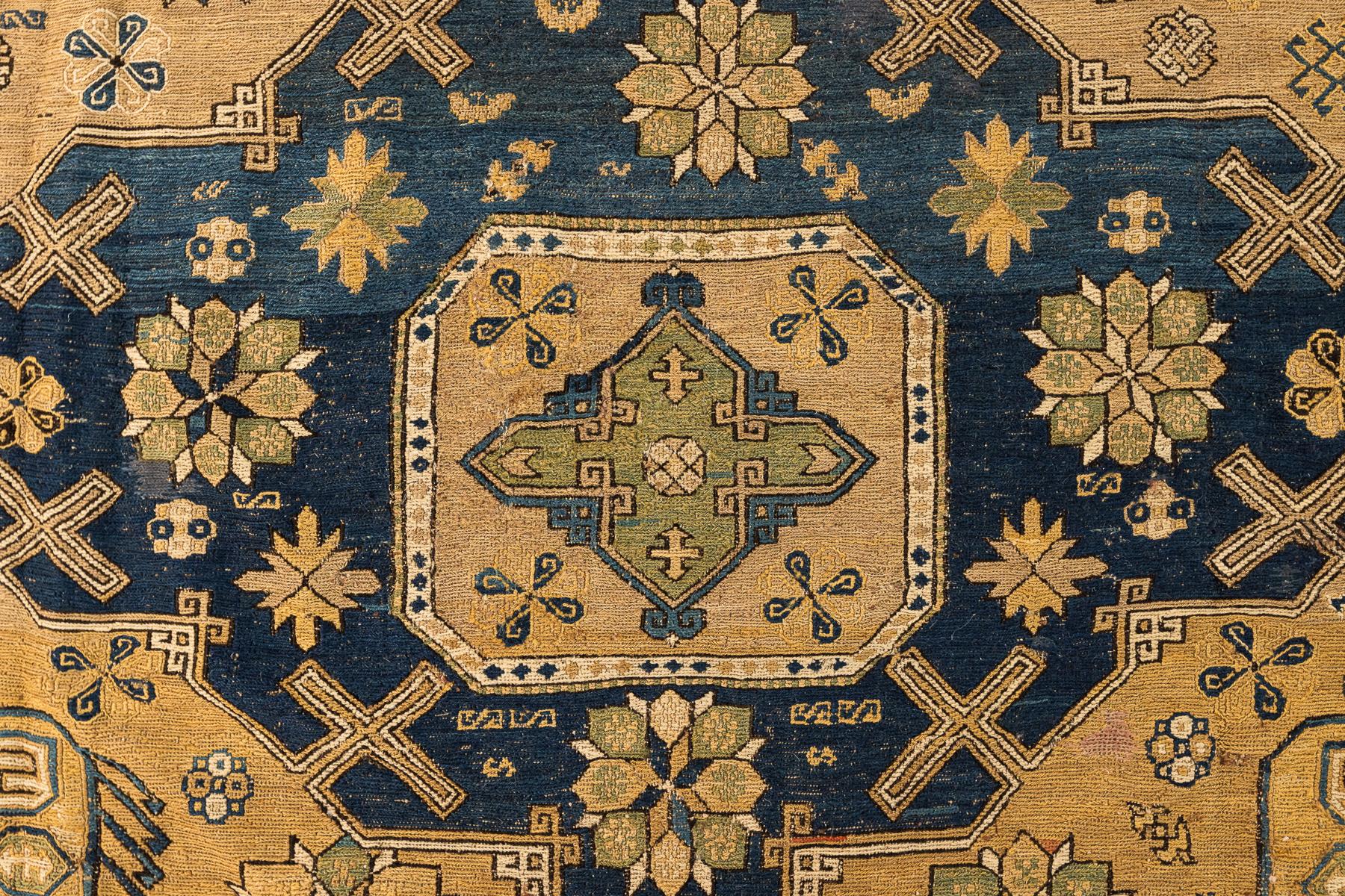 Soumak – Caucasus

This is a beautiful rug made in the Caucasian Mountains that features a geometric pattern perfect for design styles ranging from classic to contemporary. The colours blend to create an elegant, rich and sophisticated look. This