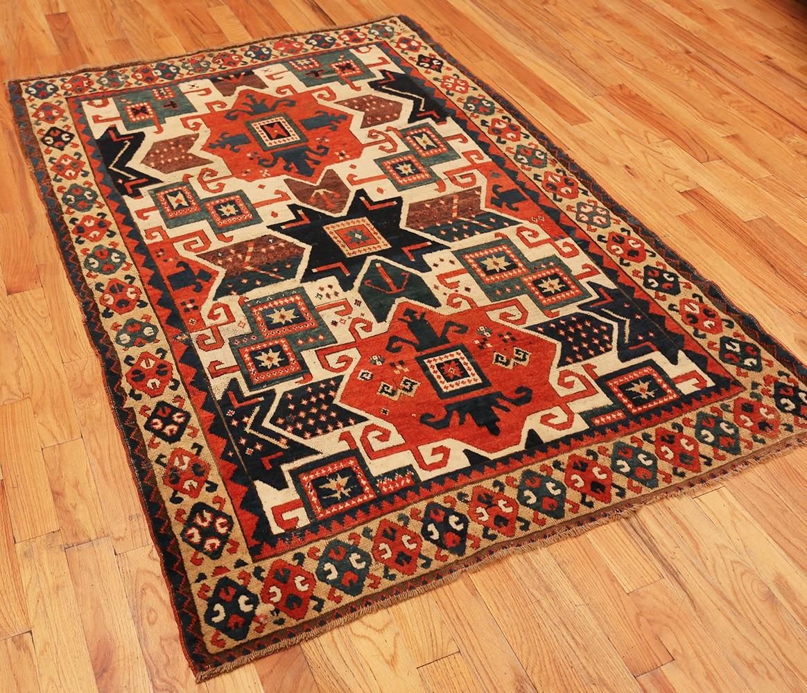 A breathtaking and rare collectible antique Caucasian star Kazak rug, country of origin / rug type: Antique Caucasian rugs, date: circa mid-19th century. Size: 4 ft 10 in x 7 ft (1.47 m x 2.13 m)

This highly collectible and rare antique Caucasian
