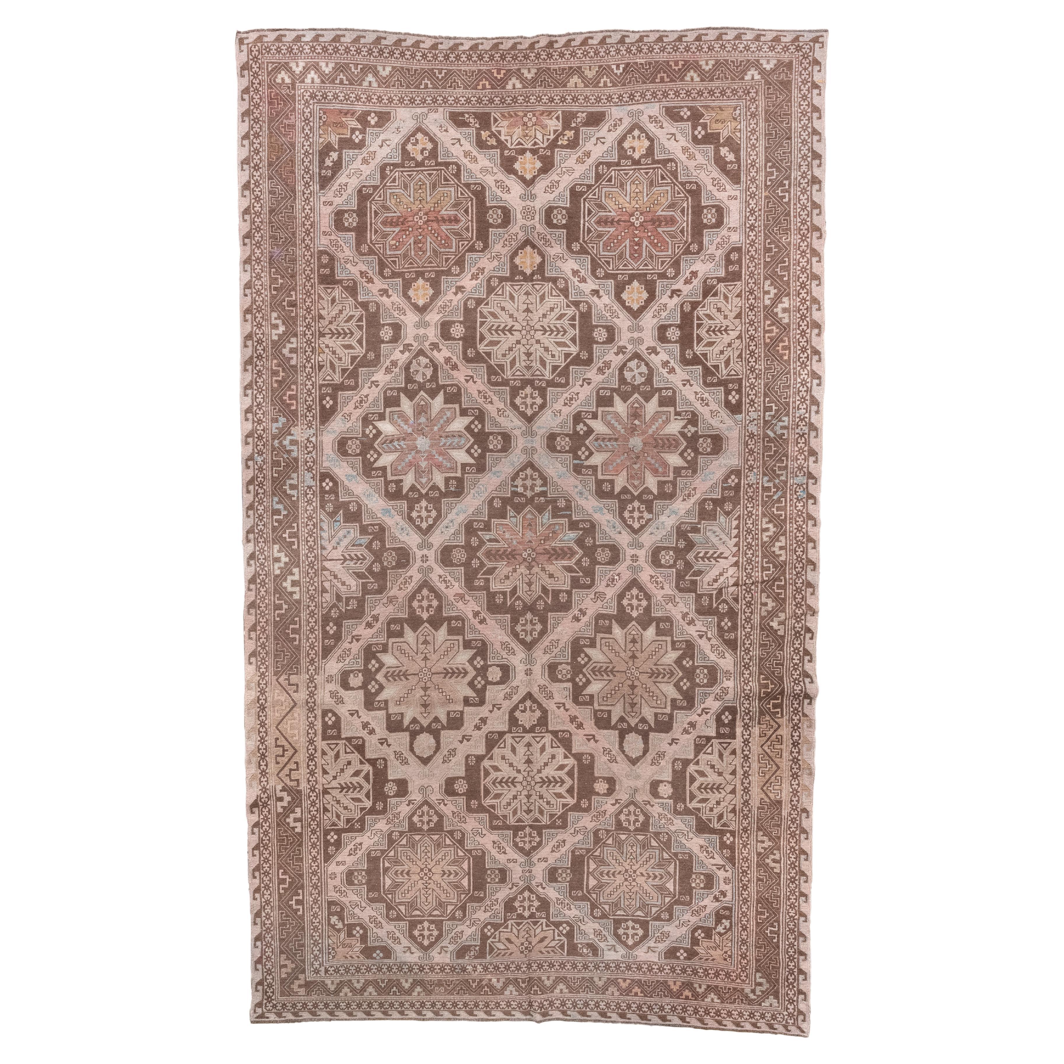 Antico tappeto Sumak caucasico con medaglioni a stella nei toni della terra in vendita