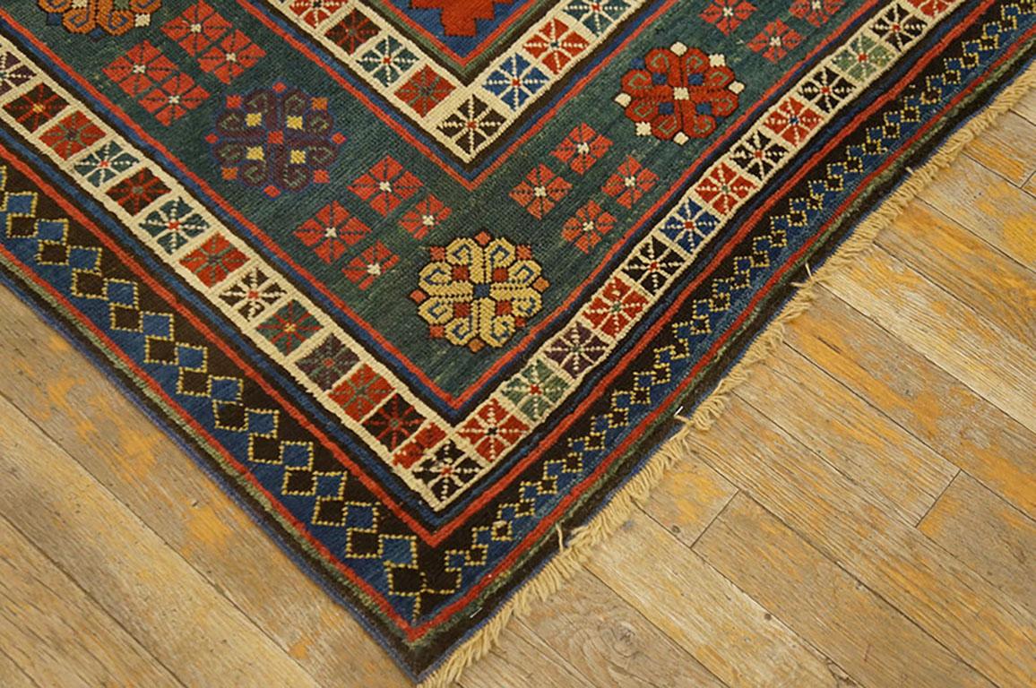 This is not your usual Talish: the field is red rather than blue and the main border is green rather than ivory. The warm red field of this southeastern Caucasian rug has two boxes and a scattering of iconic Talish volute knots. These knots appear