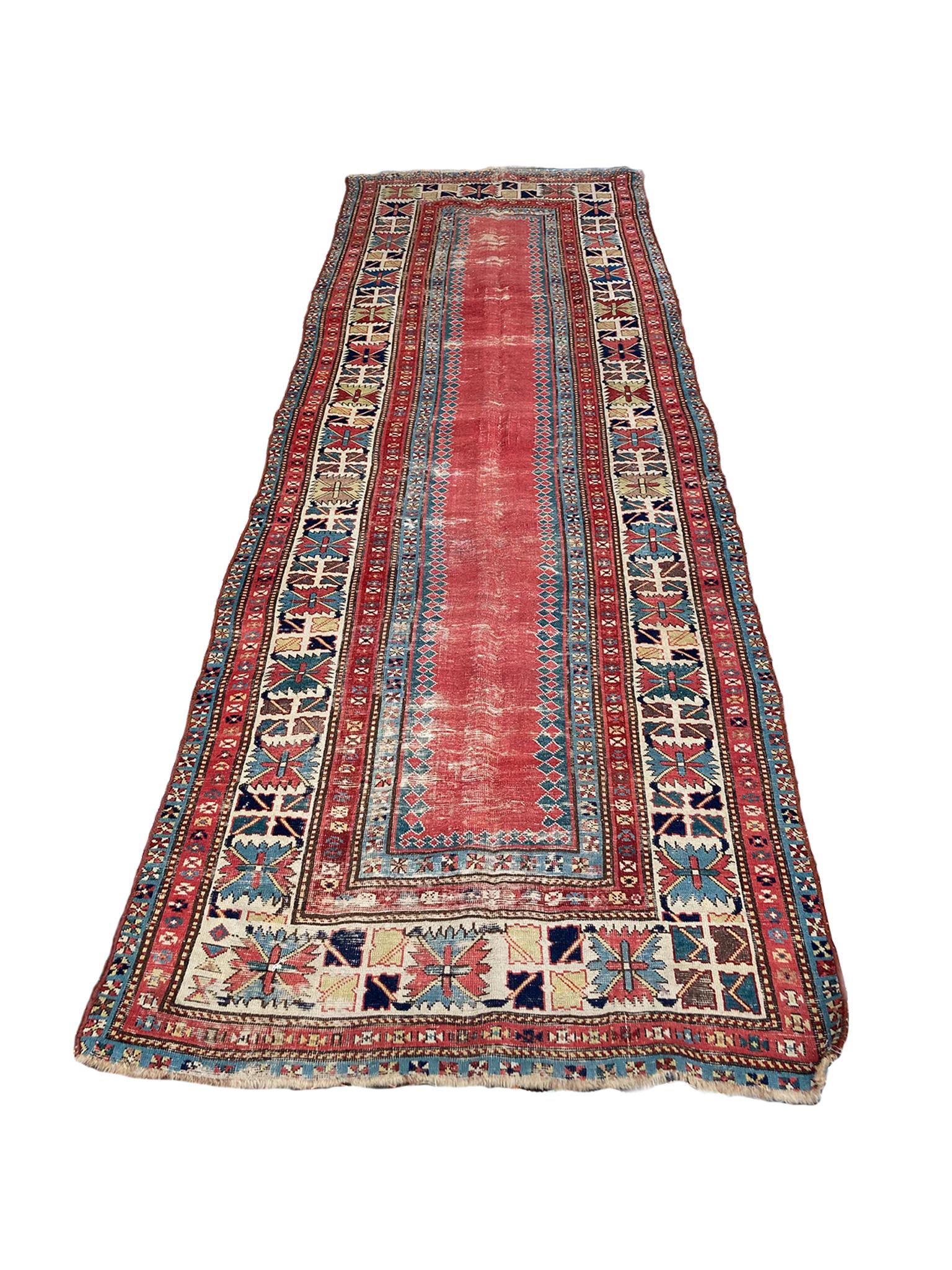 Beautifully aged Talish rug hand-knotted in the late 19th-early 20th century. The design features a central field in a bold red hue, framed by a series of borders that are richly patterned with geometric motifs. 

Dimensions:
3' 4
