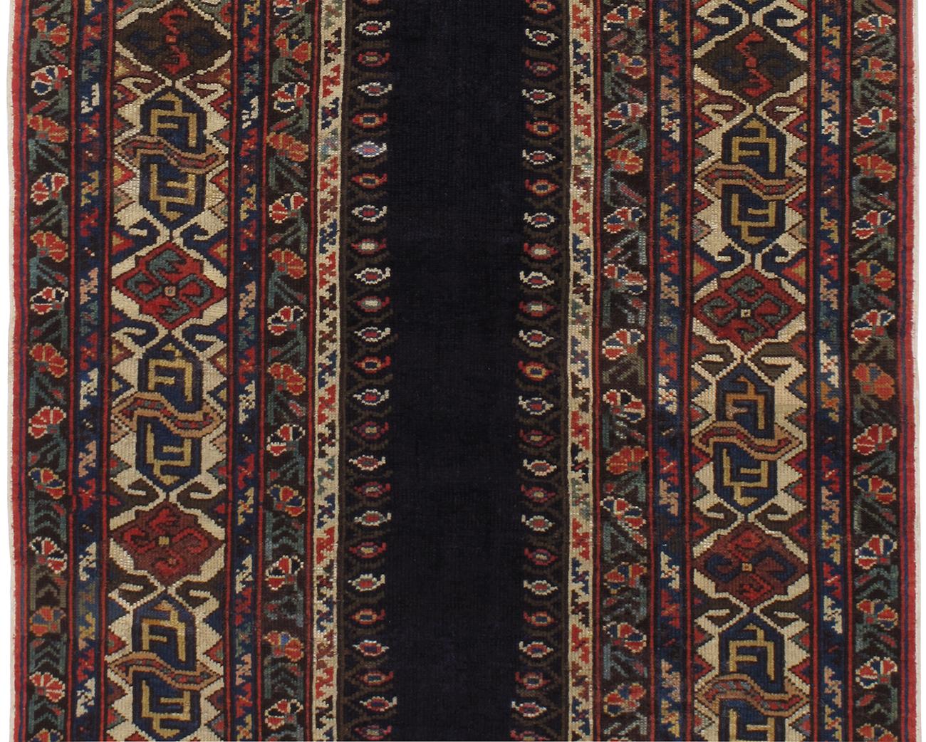 Antique Caucasian Talish runner with a dark navy background and field enclosed by a rich, intricate border. Runner size is 3'0
