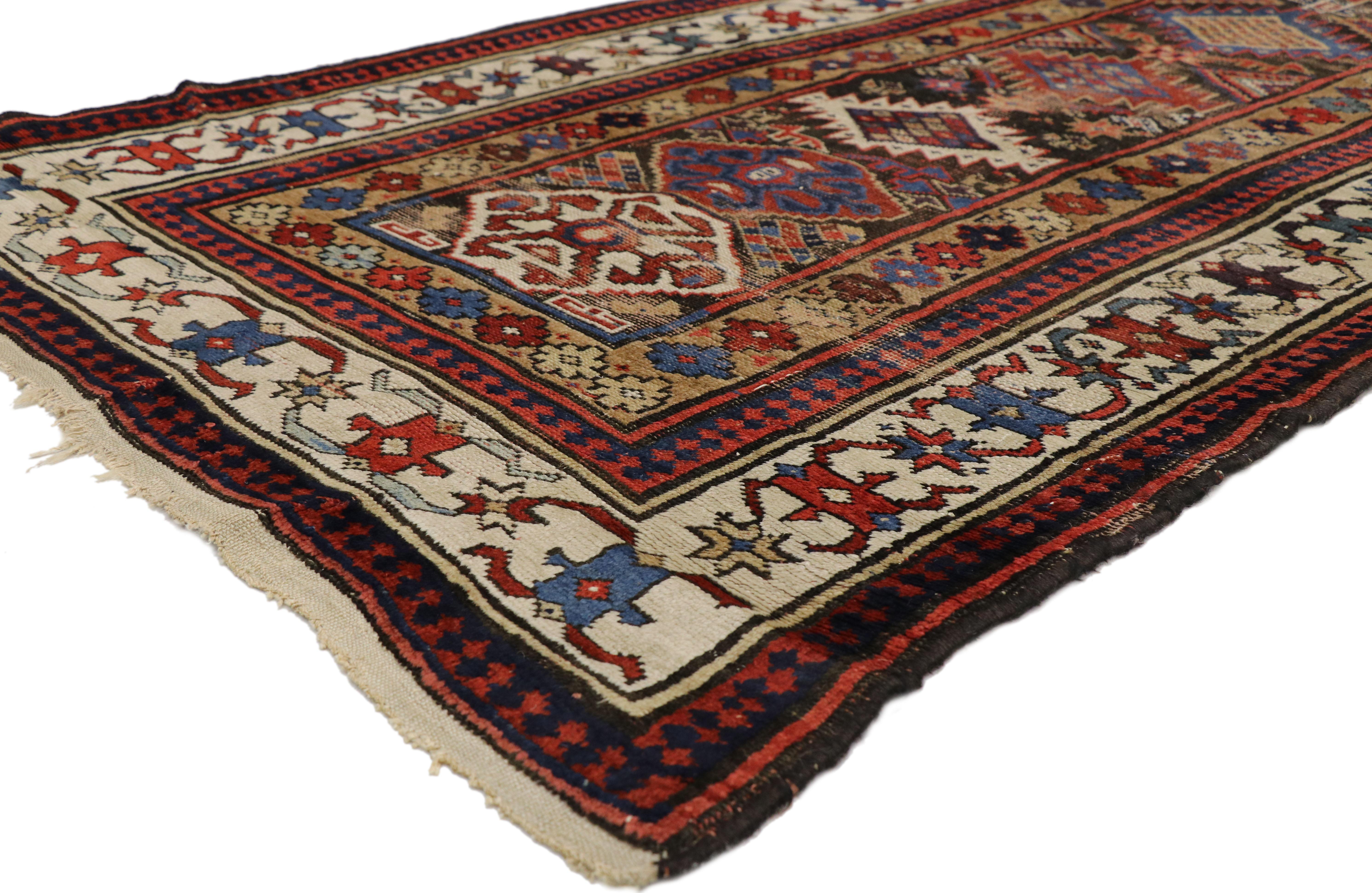 77059 Antique Caucasian Tribal Kazak Hallway Runner with Art Deco Tribal Style 03'06 x 11'06. Based on traditional designs from the Caucasus region, this hand-knotted wool antique Russian Kazak runner features an array of latch hook medallions