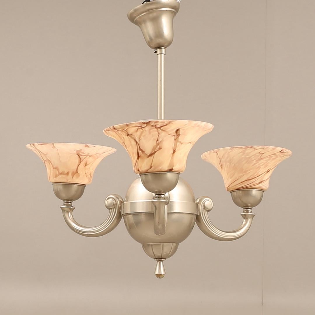Antique Silver CEILING LAMP, Pendant Light Long Art Deco Chandelier with three pink cups from the 1920s
The pewter silver Swedish pendant chandelier is a circular cut glass shade placed within a frame and suspended from decorative rods featuring