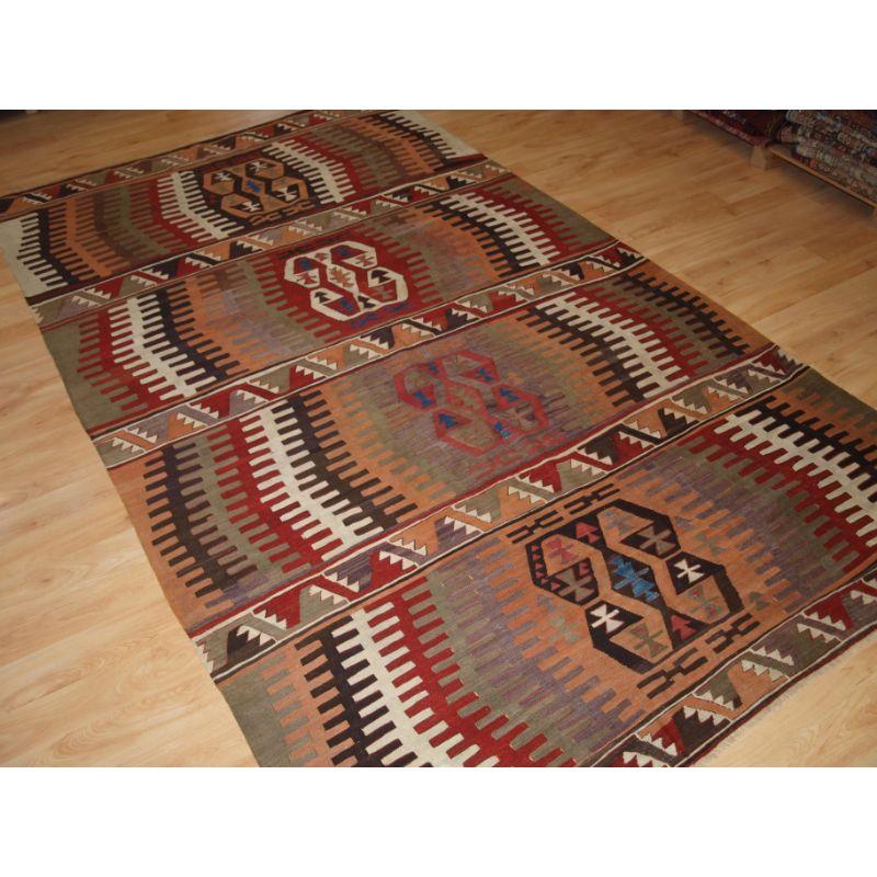 Antique Central Anatolian Konya kilim of striking design.

A good kilim with pleasing soft colour and traditional geometric design.

Excellent condition with very slight even wear.

Hand washed and ready for use or display.

Additional