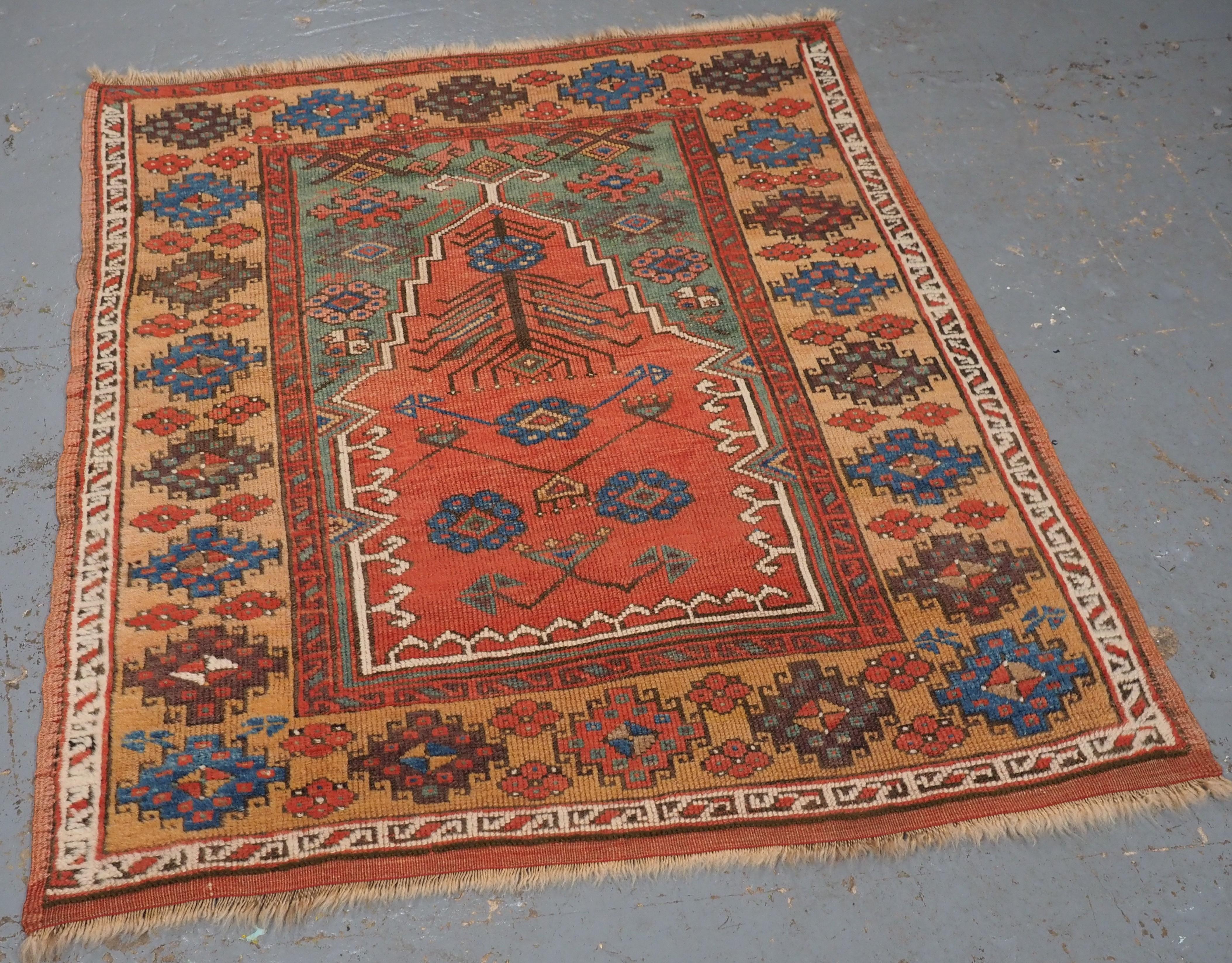 ize: 4ft 3in x 3ft 6in (130 x 106cm).

Antique Central Anatolian Konya region village prayer rug.

Circa 1850.

A superb example of a Konya prayer rug, the soft red central mihrab is floating on a green ground, the rug is framed by a main border in