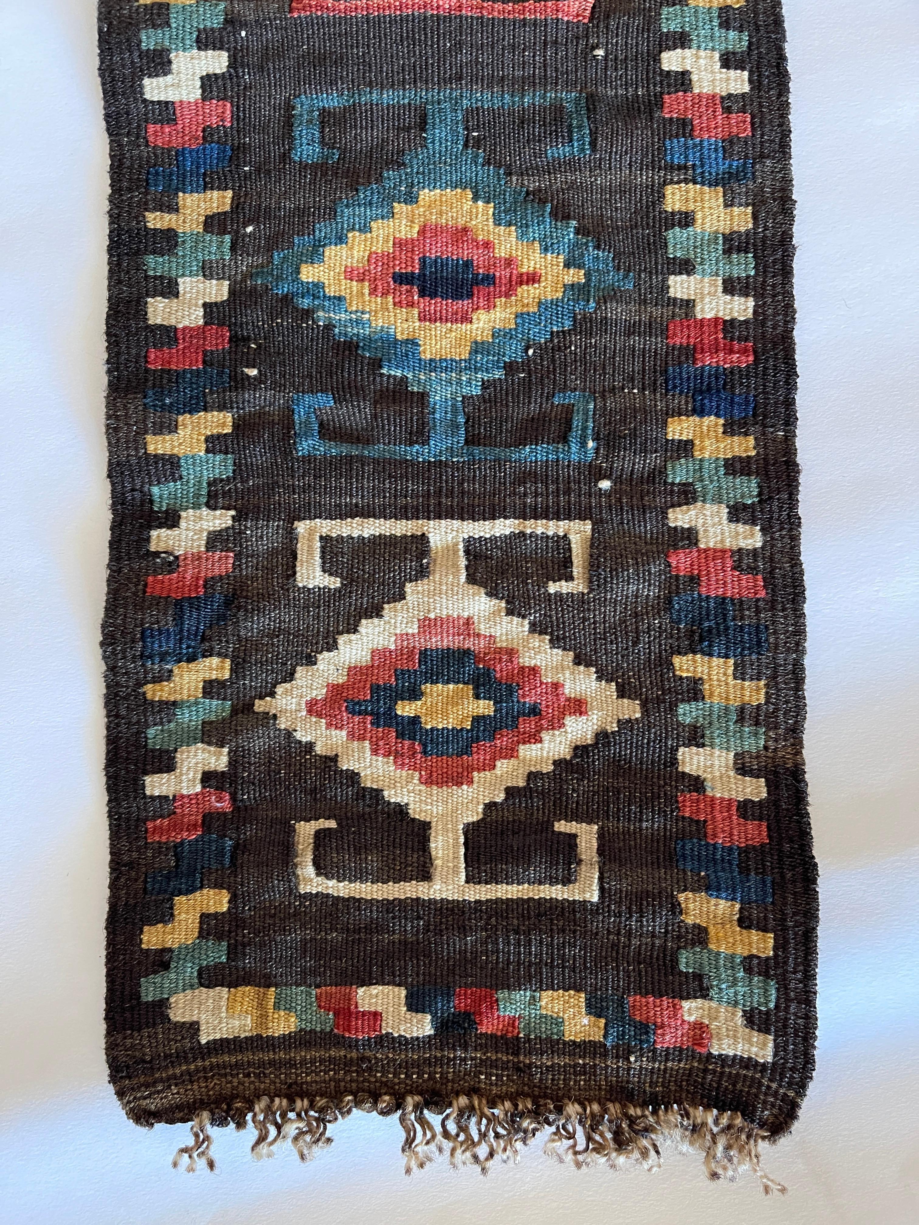 Long Central Asian natural dyed wool flat weave tent band runner, with traditional geometric design. Measures 65
