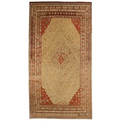 Tapis ancien d'Asie centrale au design Khotan avec plusieurs bordures florales, vers 1900