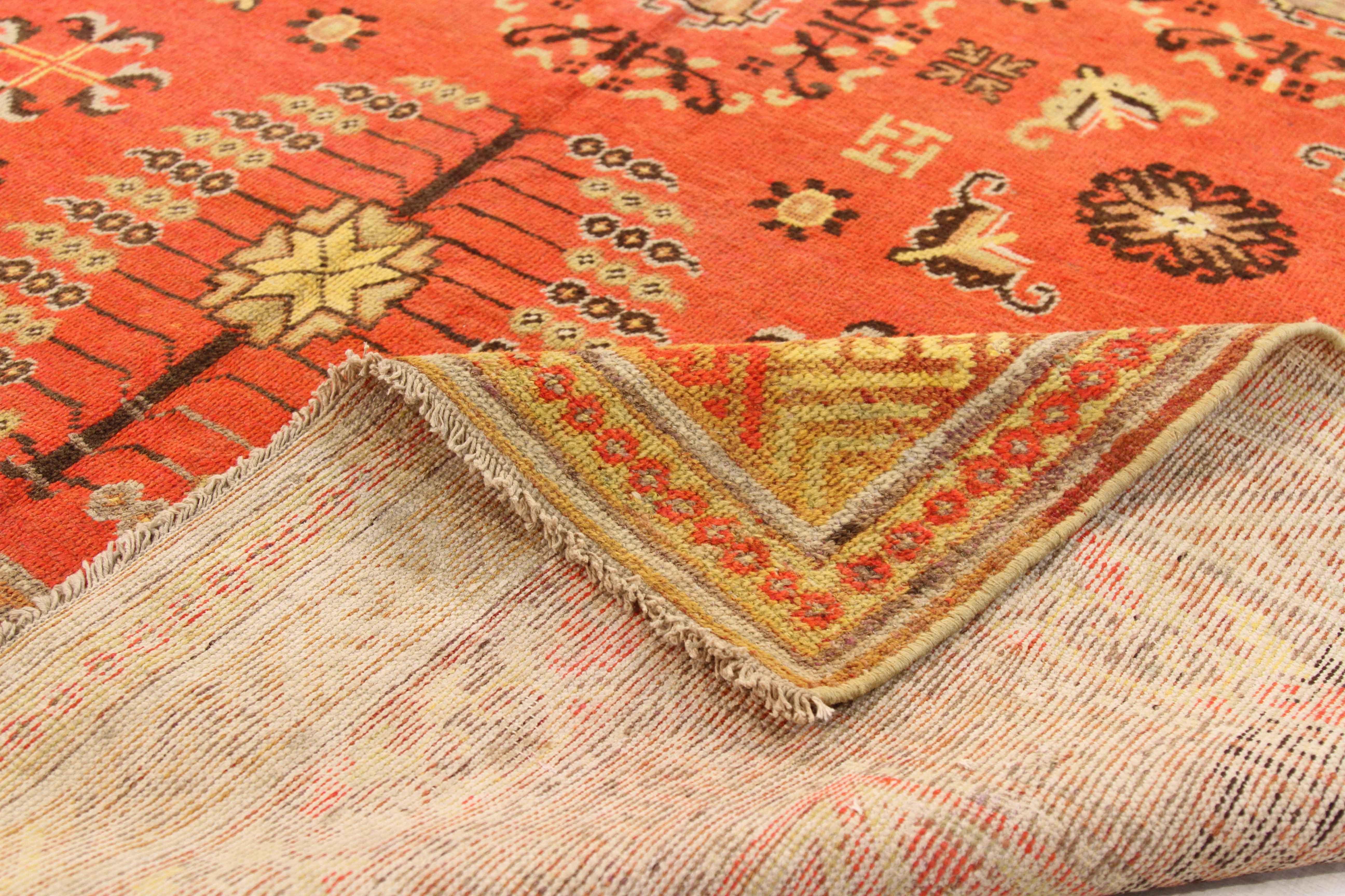 Antique Central Asian rug crafted from finest wool and natural dyes in the region using hand weaving techniques perfected by Khotan weavers. It features lovely oriental figures on the centre field surrounded by traditional and tribal geometric