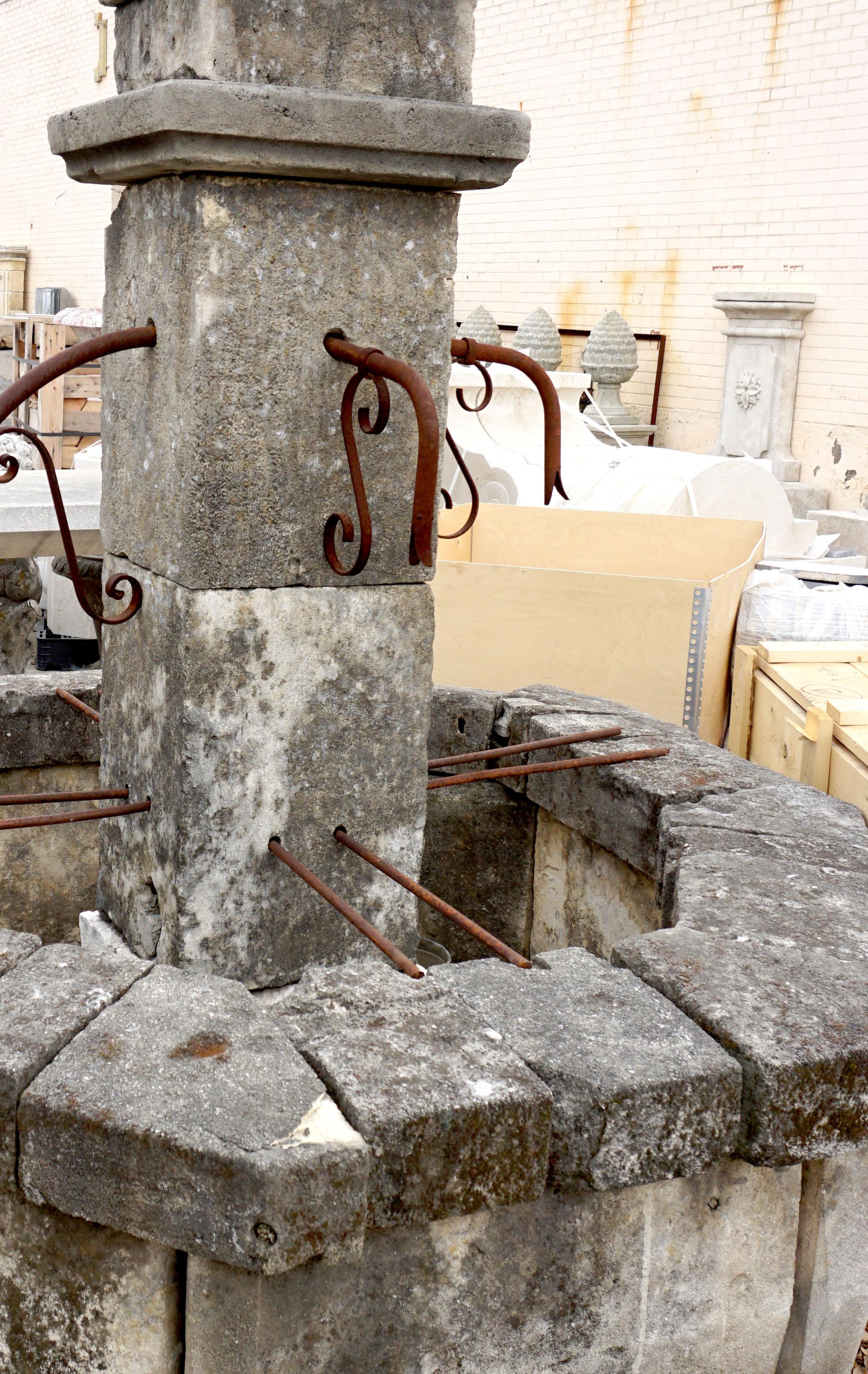 Here we offer an octagonal central fountain hand carved from limestone with four iron spouts. This fountain is very clean and straight in it's appointments and basin wall. This fountain will go nicely with any decorative style as it's age will lean