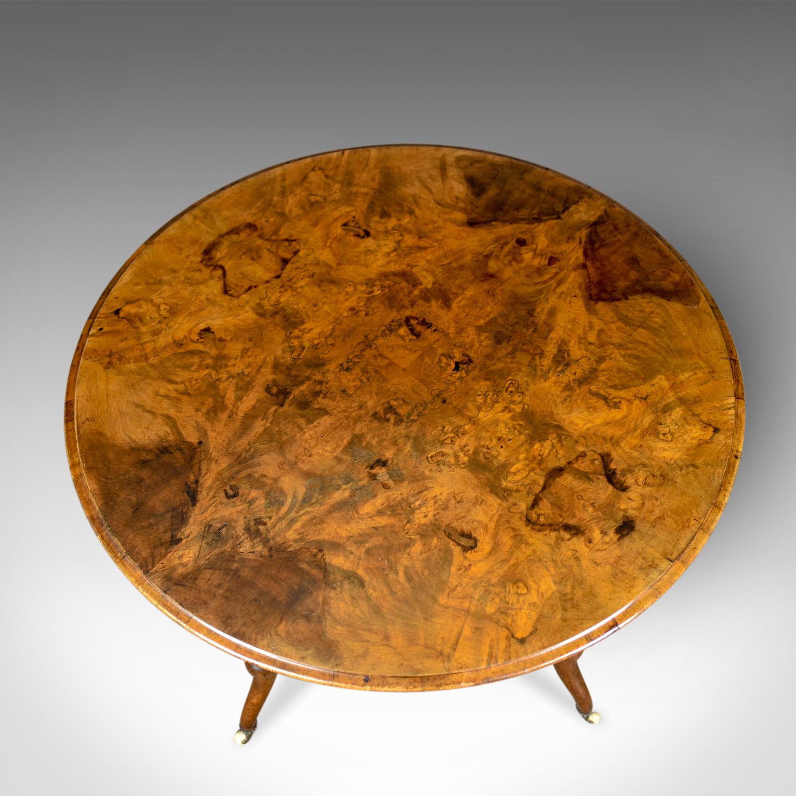 This is a mid-size antique centre table. An English, Victorian, circular, burr walnut tea table dating to the mid-19th century, circa 1870.

Spectacular grain interest in the quarter veneered burr walnut
Desirable aged patina and good consistent