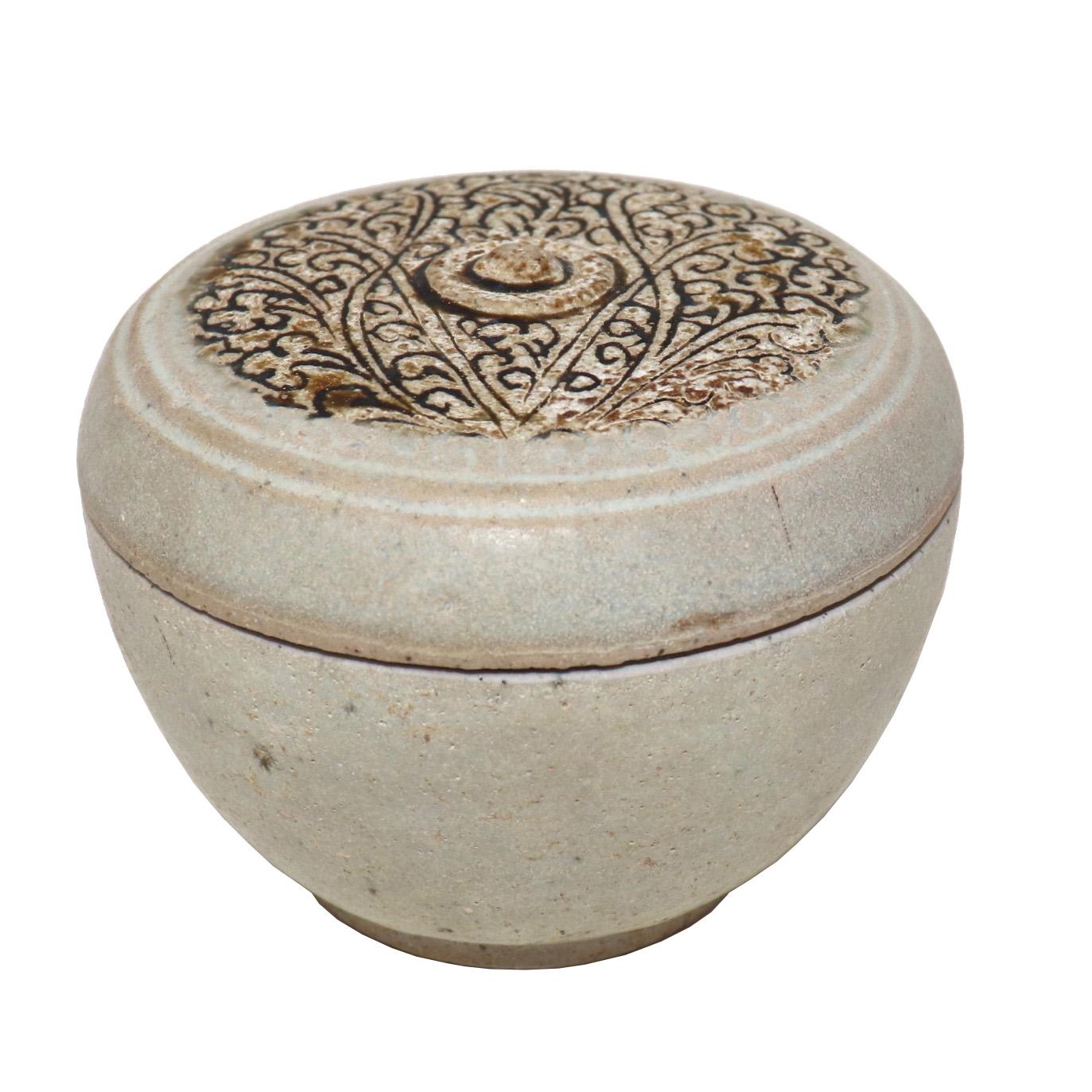 Antique ceramic box with cover from the Sawankhalok kilns, Thailand of shouldered globular form with a flat top having incised foliate vine plant decoration featured in a green/brown glaze with a raised nipple finial on center, the shoulder and body
