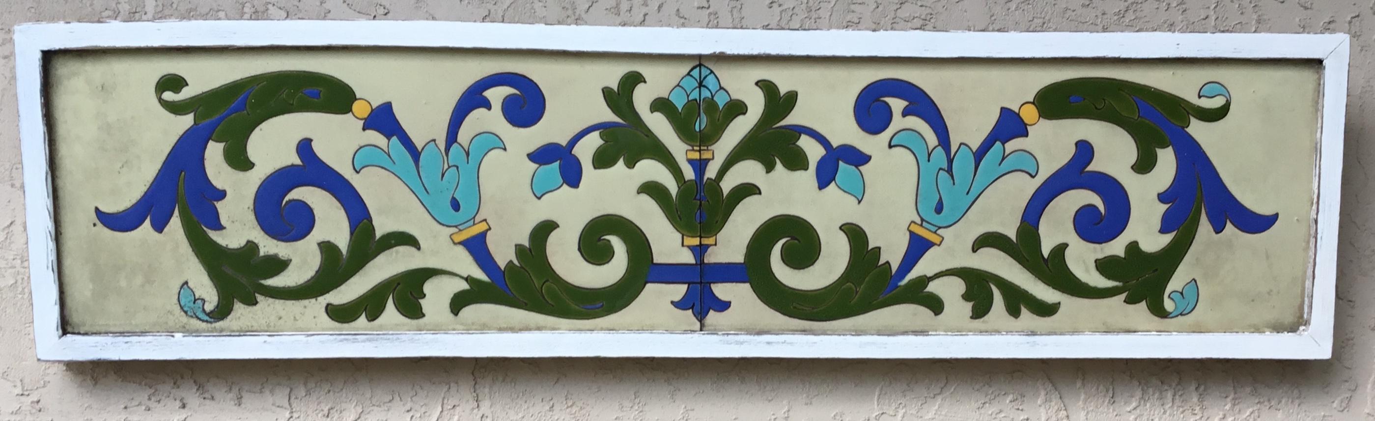 Exceptional ceramic wall hanging made of two tiles, handmade painted and glaze, beautiful motifs of flowers and scrolling vines, with vibrant colors of turquoise ,green and cobalt blue on a cream color background. The wall hanging is professionally
