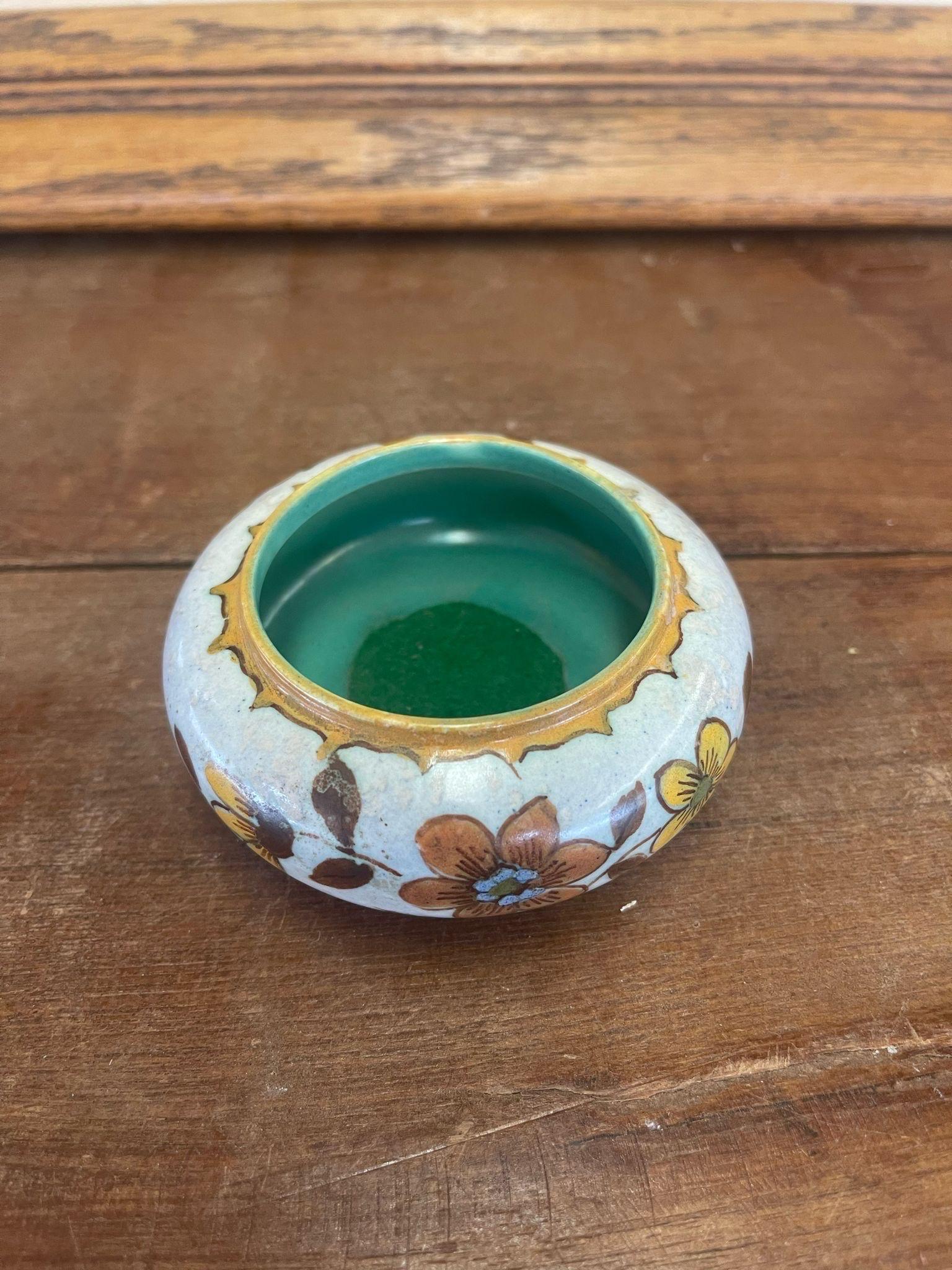 Traditional design atop this unique ceramic piece. Makers mark on the bottom, stating that was made in Holland. Circa 1903. Vintage Condition Consistent with Age as Pictured.

Dimensions. 5 W ; 4 1/2 D ; 2 H