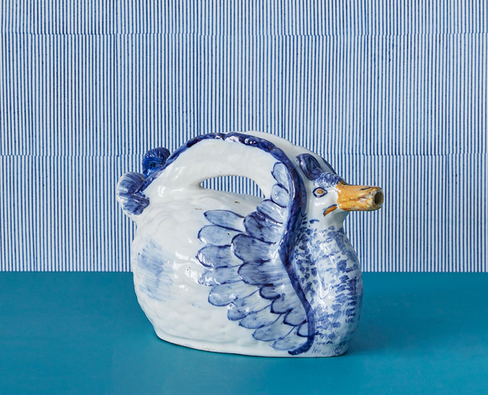 Portugal, 19th Century

Antique ceramic pitcher in the shape of a duck.

H 18 x W 29 x D 15 cm