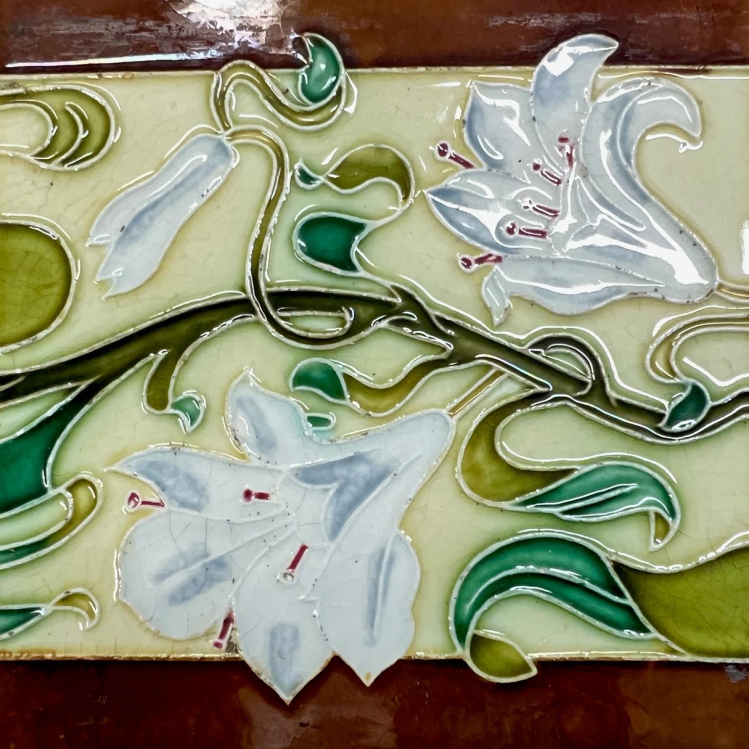 1 of the 36 amazing and unique handmade ceramic tiles. Manufactured by Societe Morialme, circa 1920s. Stylized design in wonderful colors brown, yellow, green. These tiles would be charming displayed on easels, framed or incorporated into a custom