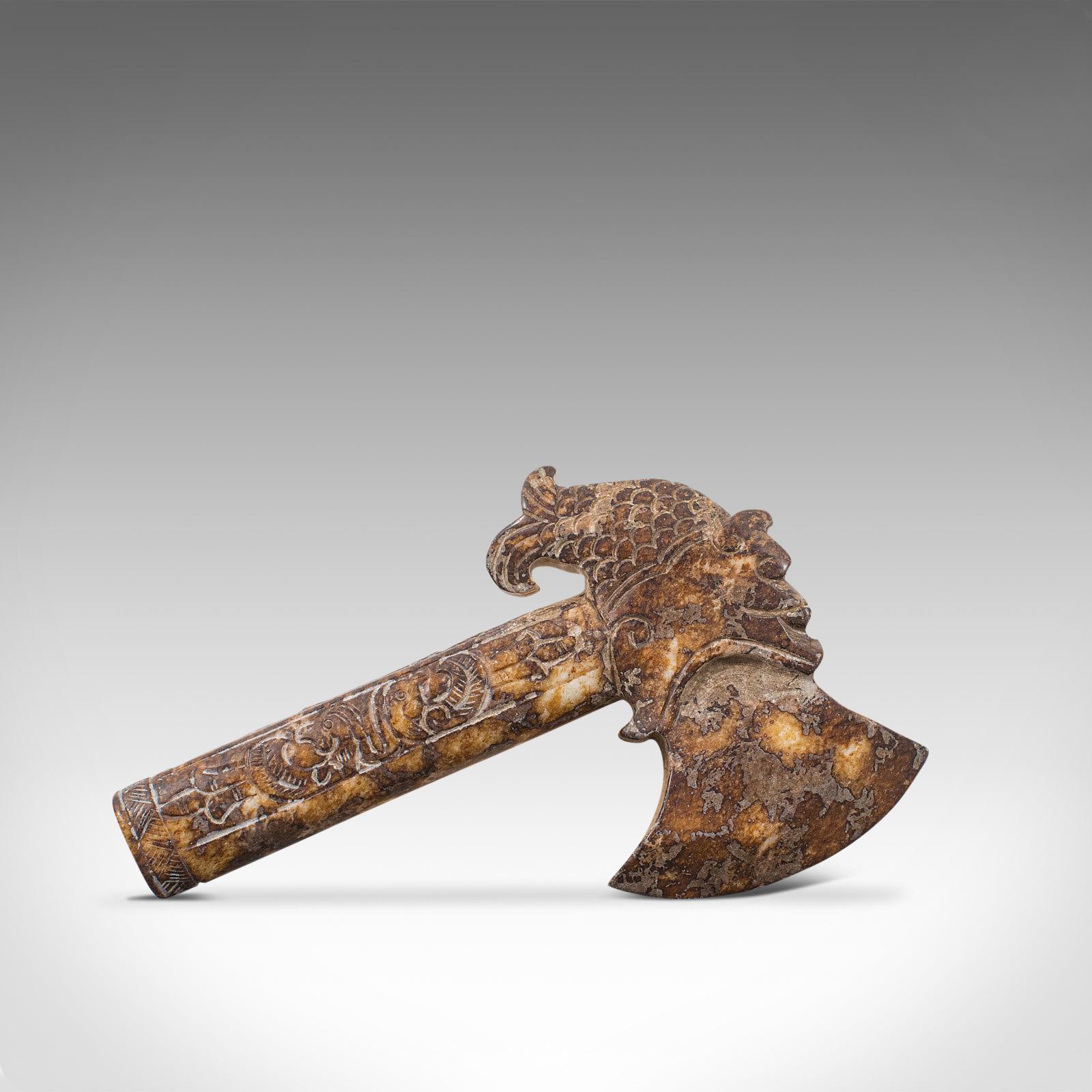 This is an antique ceremonial axe. A Chinese, mottled caramel jade decorative tool redolent of the Shang Dynasty, dating to the mid-19th century, circa 1850.

Striking colouration catches the eye
Displays a desirable aged patina
Heavily mottled