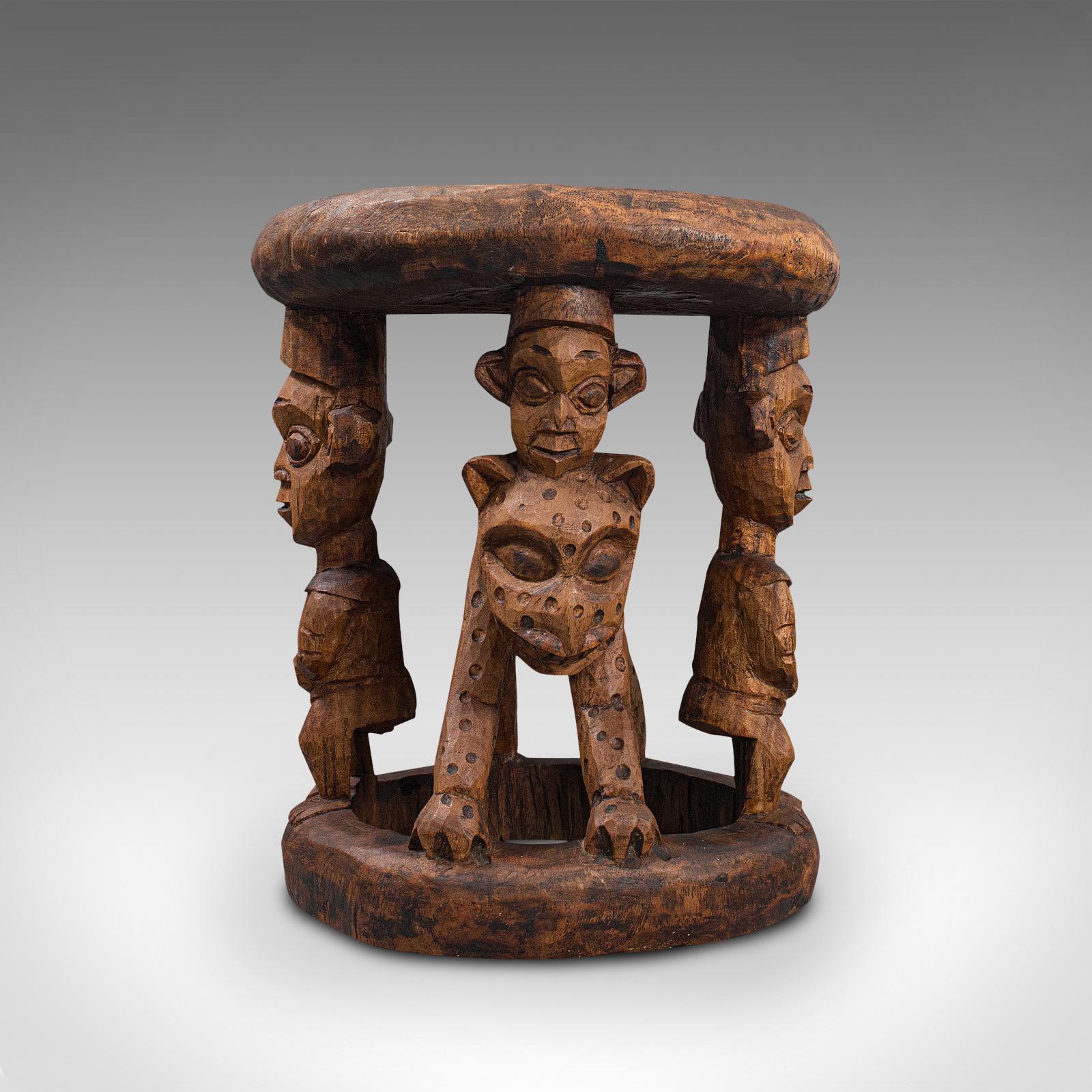 This is an antique ceremonial Yoruba chief's stool. A West African, Benin Kingdom hardwood side or lamp table, dating to the late 19th century, circa 1900.

Striking West African tribal craftsmanship
Displaying a desirable aged patina - split to