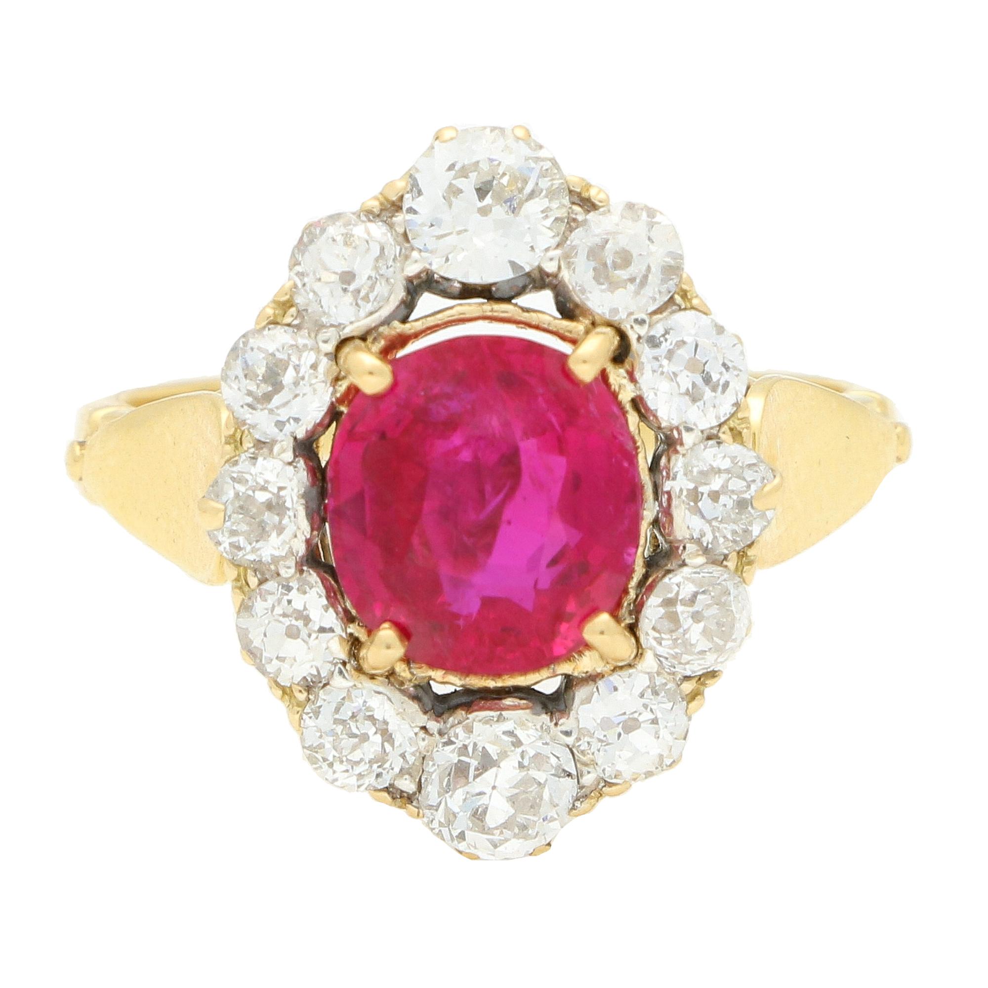 A truly stunning antique certified Burmese ruby and old cut diamond cluster ring set in 18k yellow gold. 

The ring is centrally four claw set with a beautiful certified cushion cut Burmese ruby. The ruby is extremely vibrant and is accompanied by a