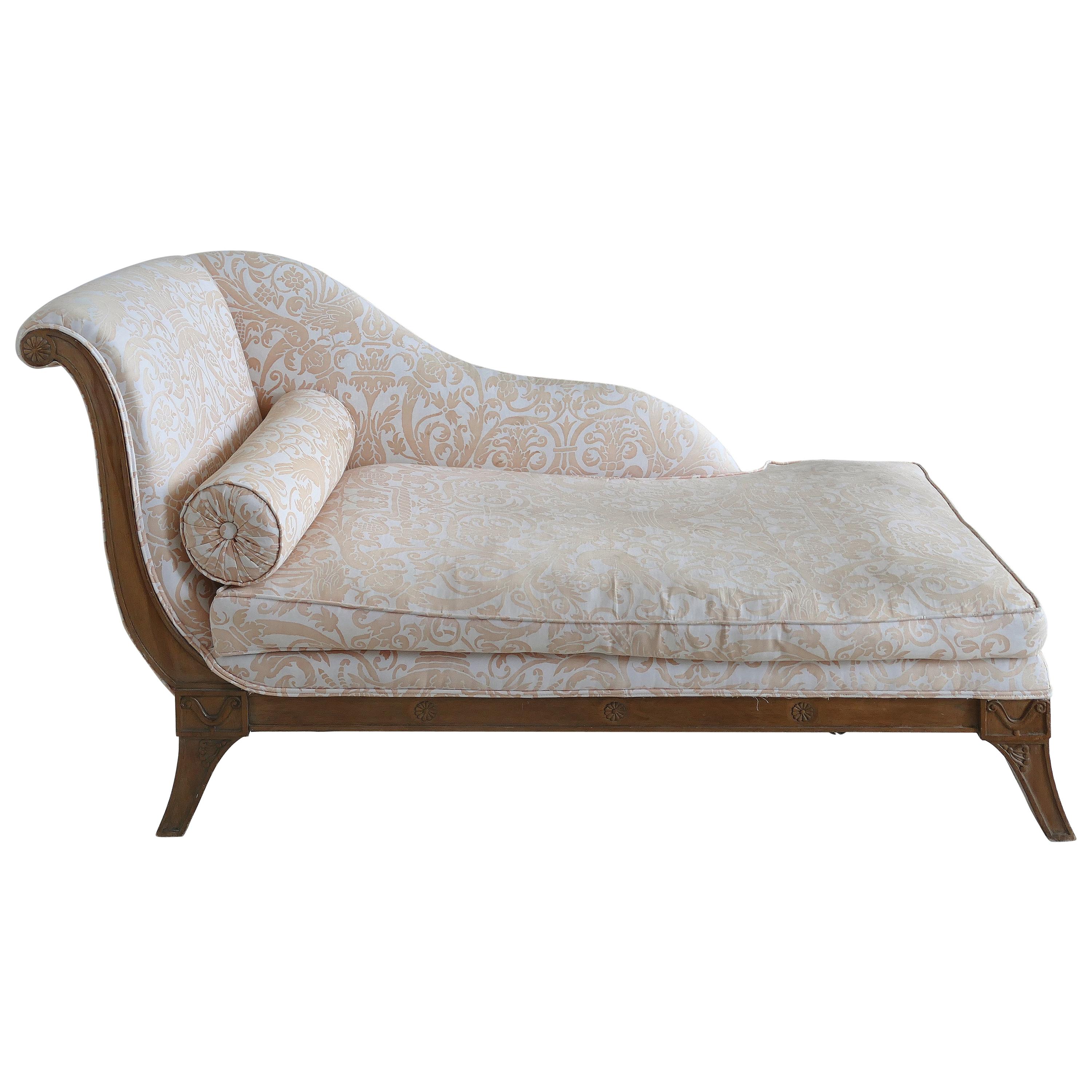 Antique Chaise Lounge Upholstered in Fortuny Fabric with a Carved Wood Frame